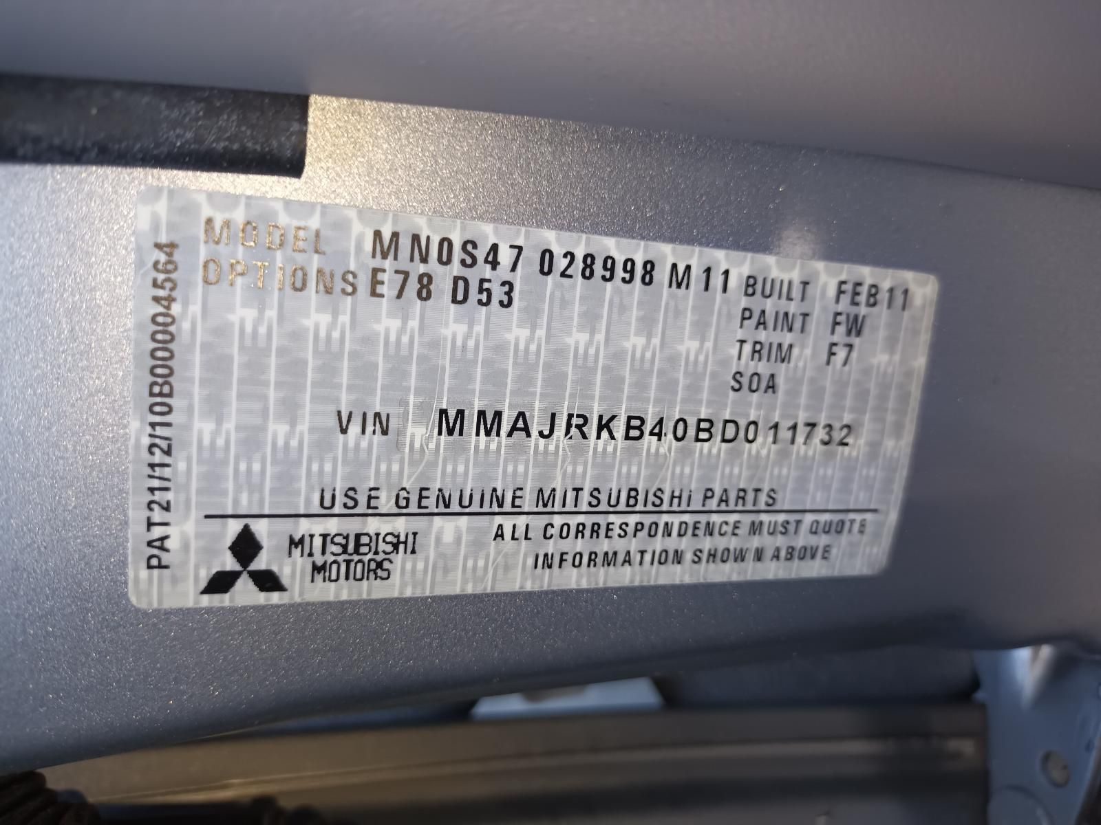 A Close Up of a Mitsubishi Motors License Plate — South West 4WD Wreckers in Harristown, QLD