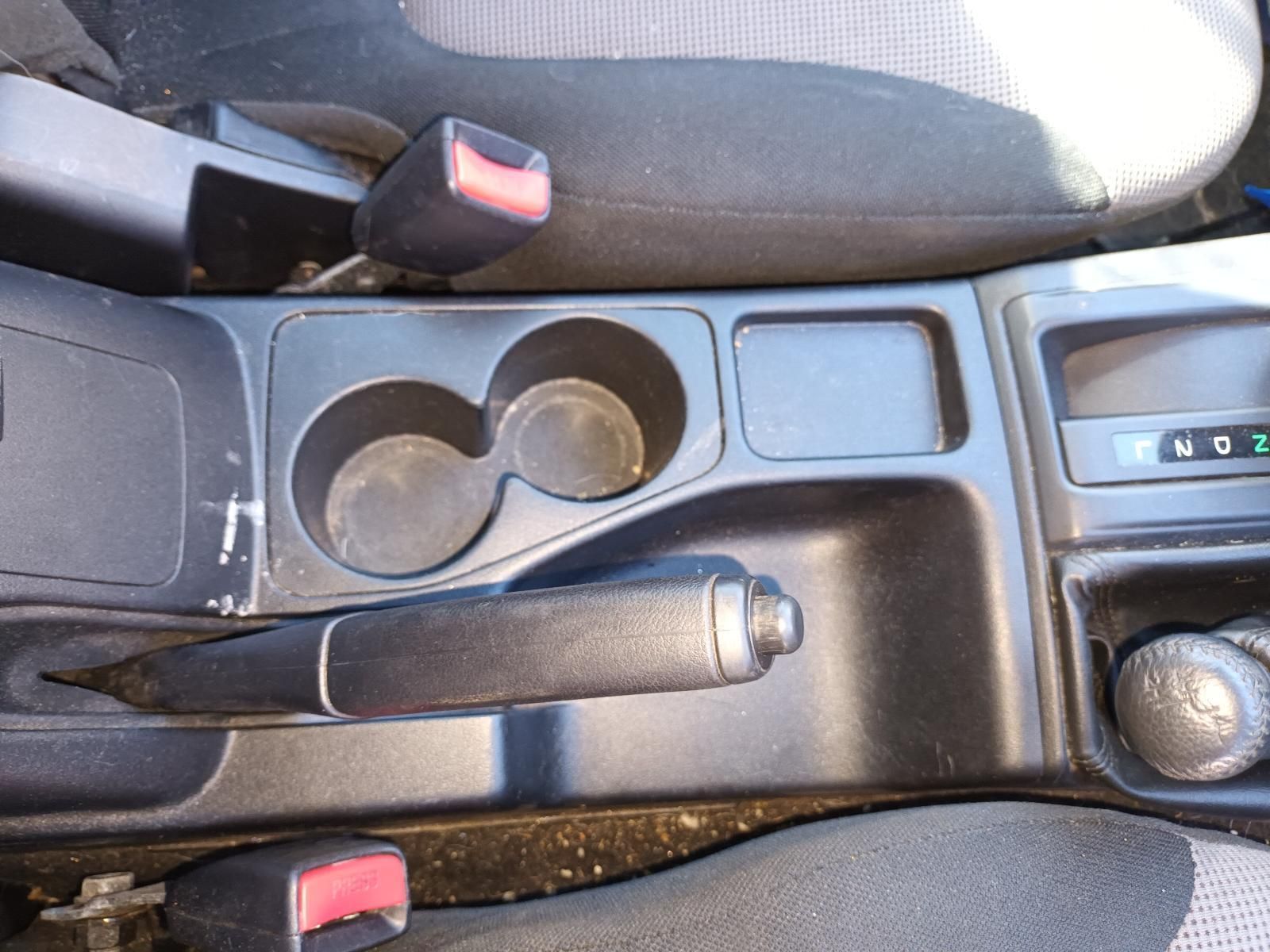 A Car Console with Two Cup Holders and a Handbrake — South West 4WD Wreckers in Harristown, QLD