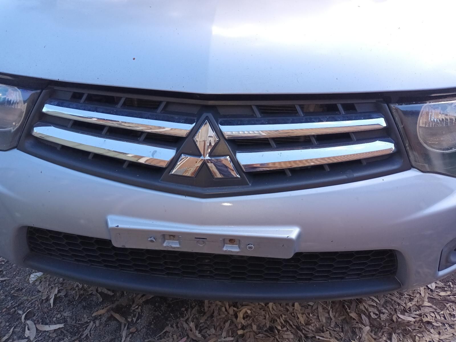 The Front Grille of a Silver Mitsubishi Car — South West 4WD Wreckers in Harristown, QLD