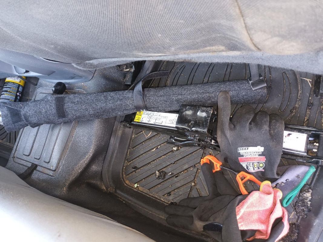 A Close Up of the Underside of a Car with Tools and a Battery — South West 4WD Wreckers in Harristown, QLD