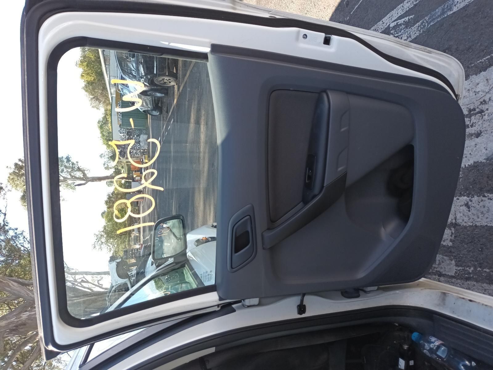 A White Car is Parked in a Parking Lot with the Door Open — South West 4WD Wreckers in Harristown, QLD