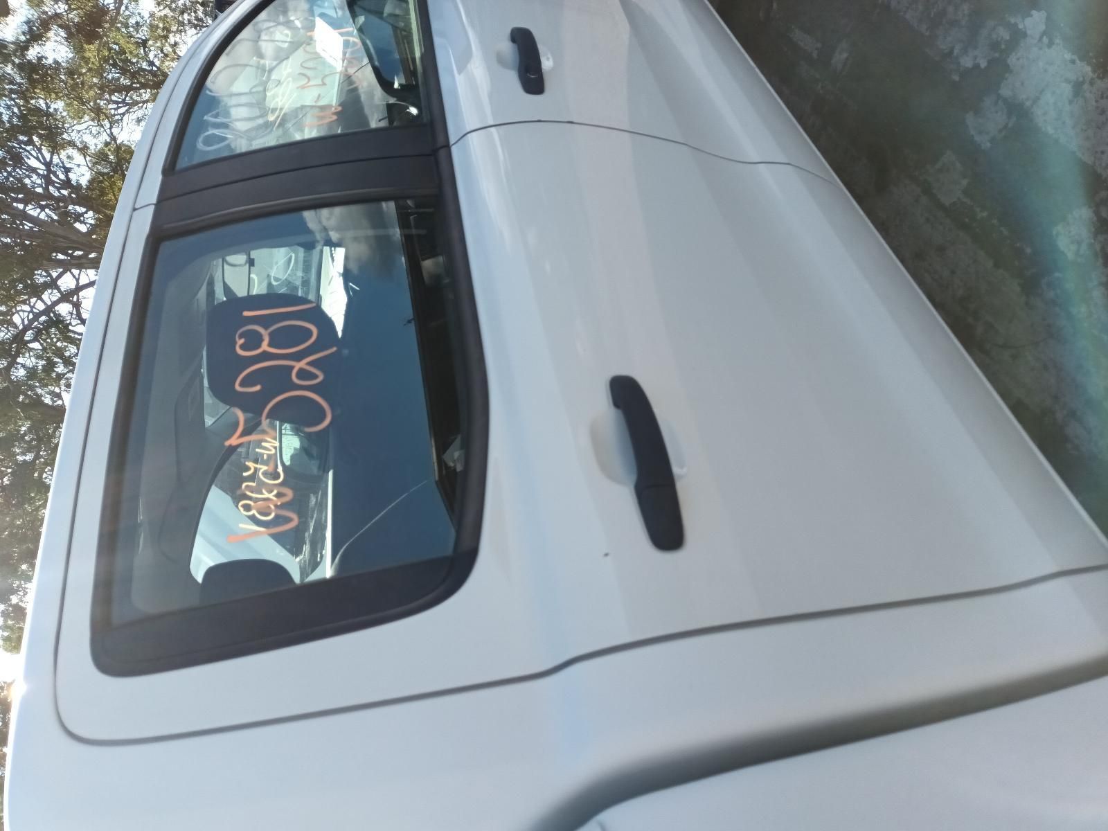 A White Car with a Written on the Back Window — South West 4WD Wreckers in Harristown, QLD