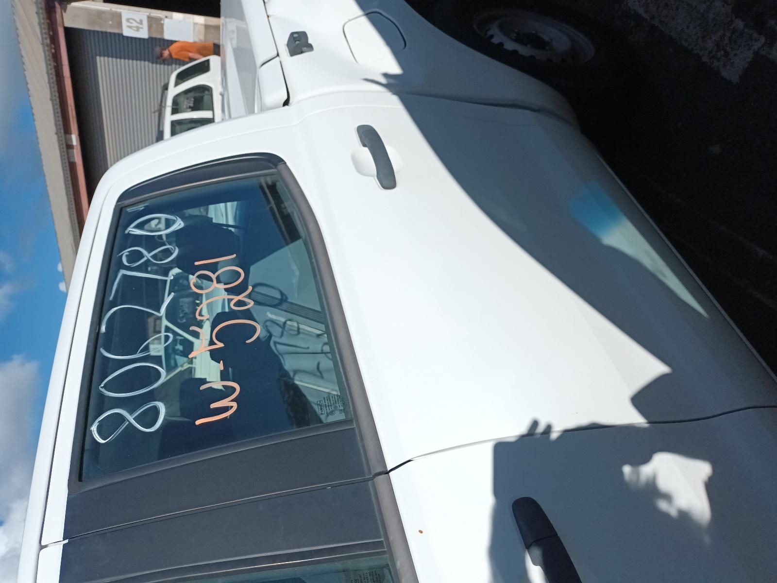A White Car with Numbers Written on the Back Window — South West 4WD Wreckers in Harristown, QLD