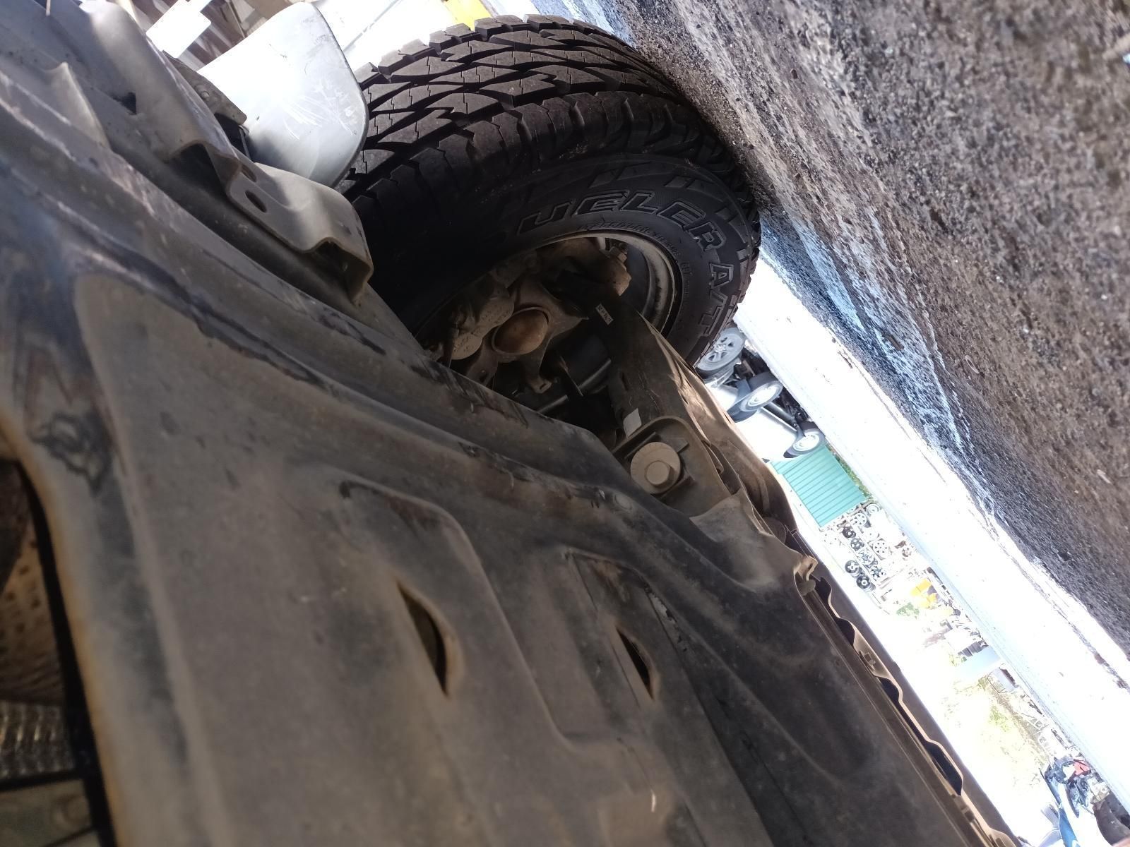 A Close Up of the Underside of a Car with a Tire on It — South West 4WD Wreckers in Harristown, QLD