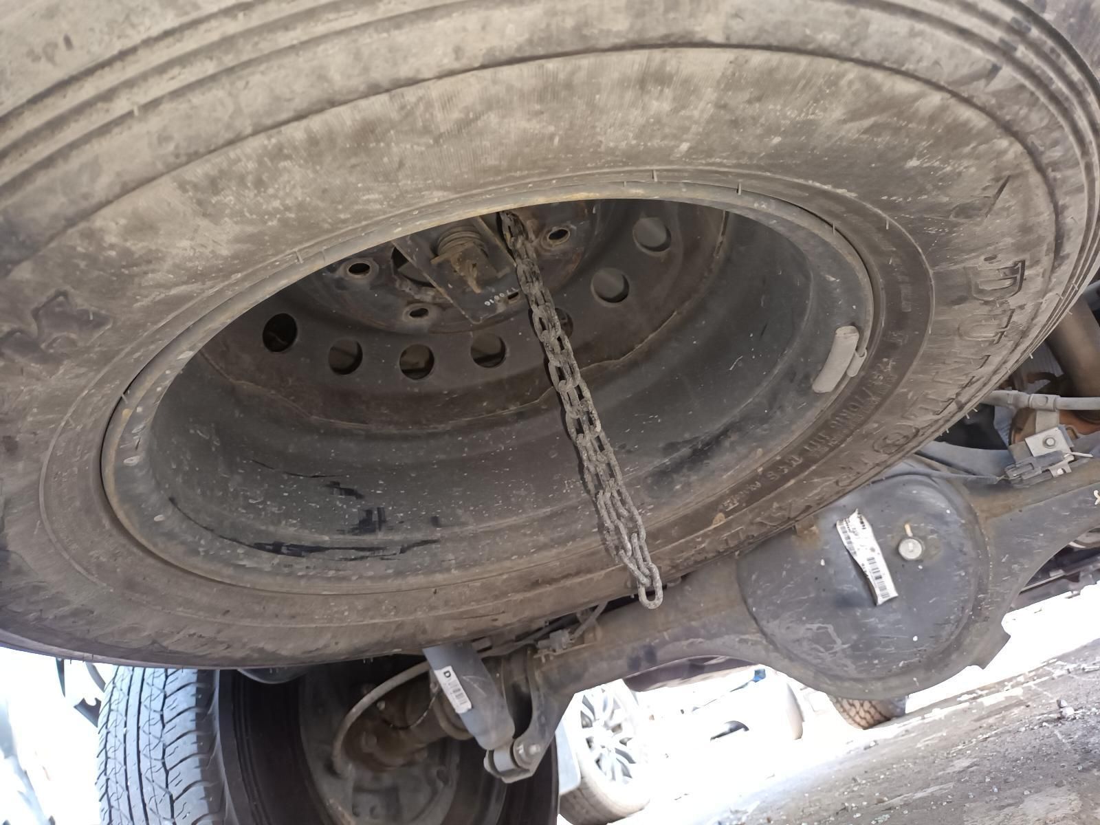 A Close Up of a Tire with a Chain Attached to It — South West 4WD Wreckers in Harristown, QLD