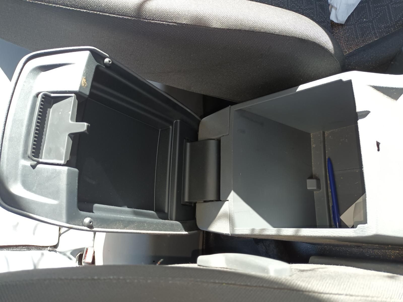 A Car Console with the Lid Open and a Pen in It — South West 4WD Wreckers in Harristown, QLD
