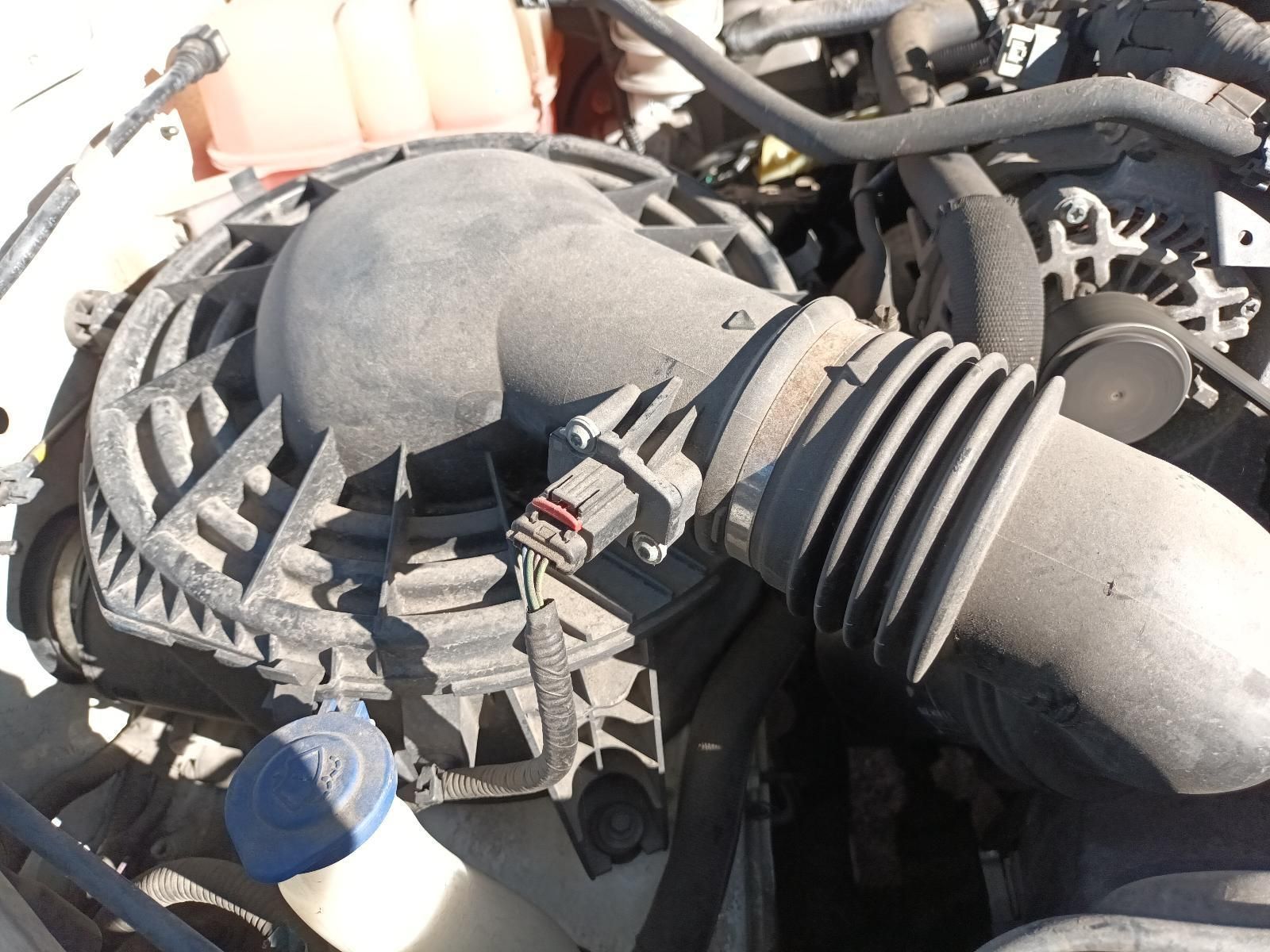 A Close Up of a Car Engine with a Hose and a Fan — South West 4WD Wreckers in Harristown, QLD