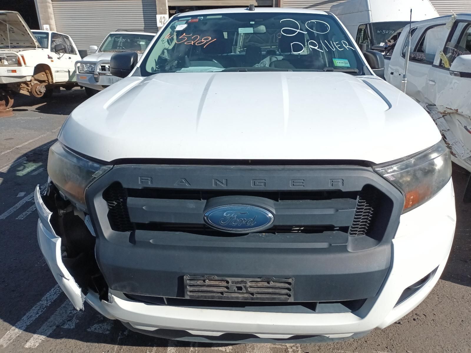 A White Ford Ranger is Parked in a Parking Lot — South West 4WD Wreckers in Harristown, QLD