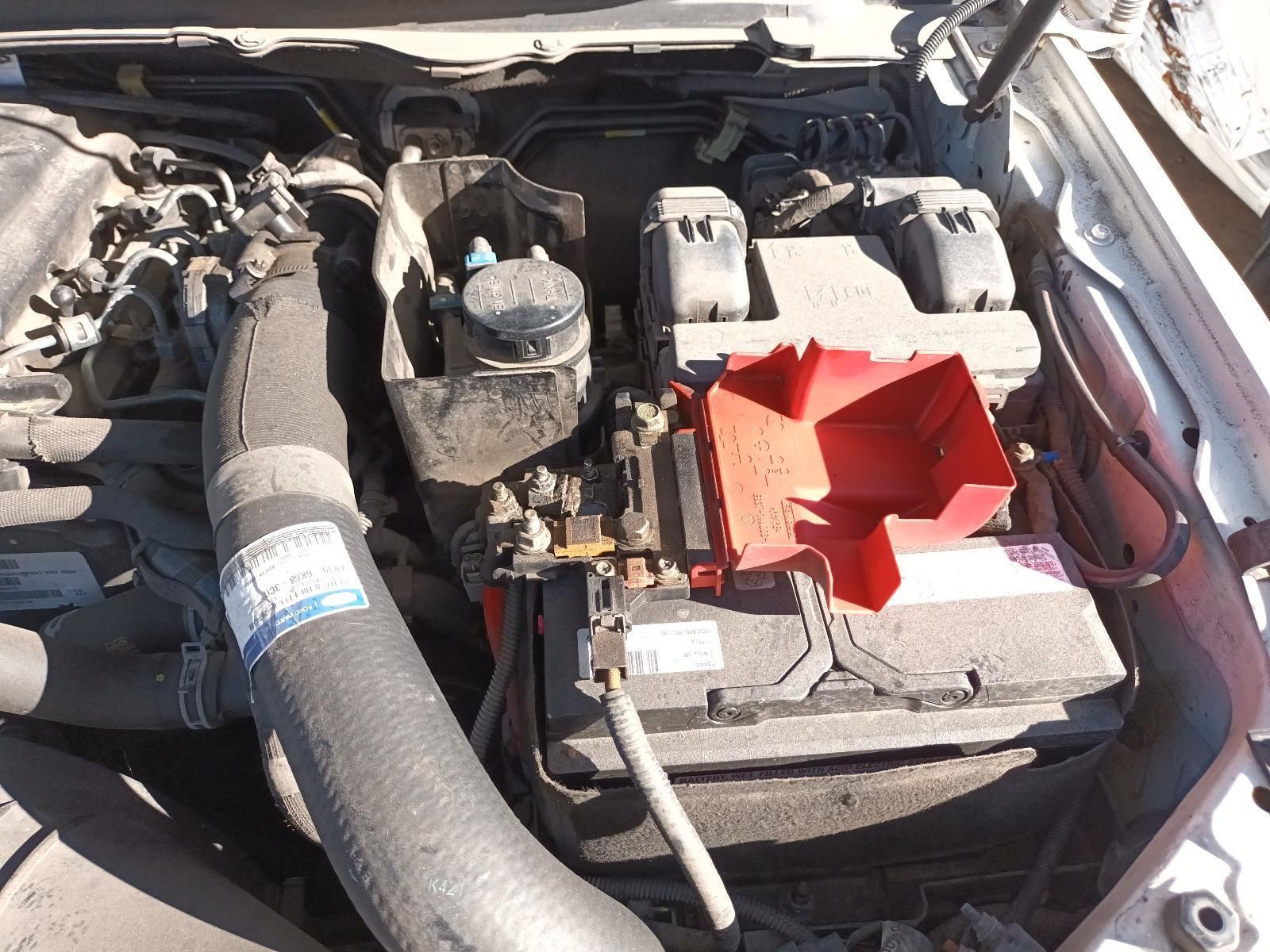 A Close Up of a Car Engine with a Battery in It — South West 4WD Wreckers in Harristown, QLD