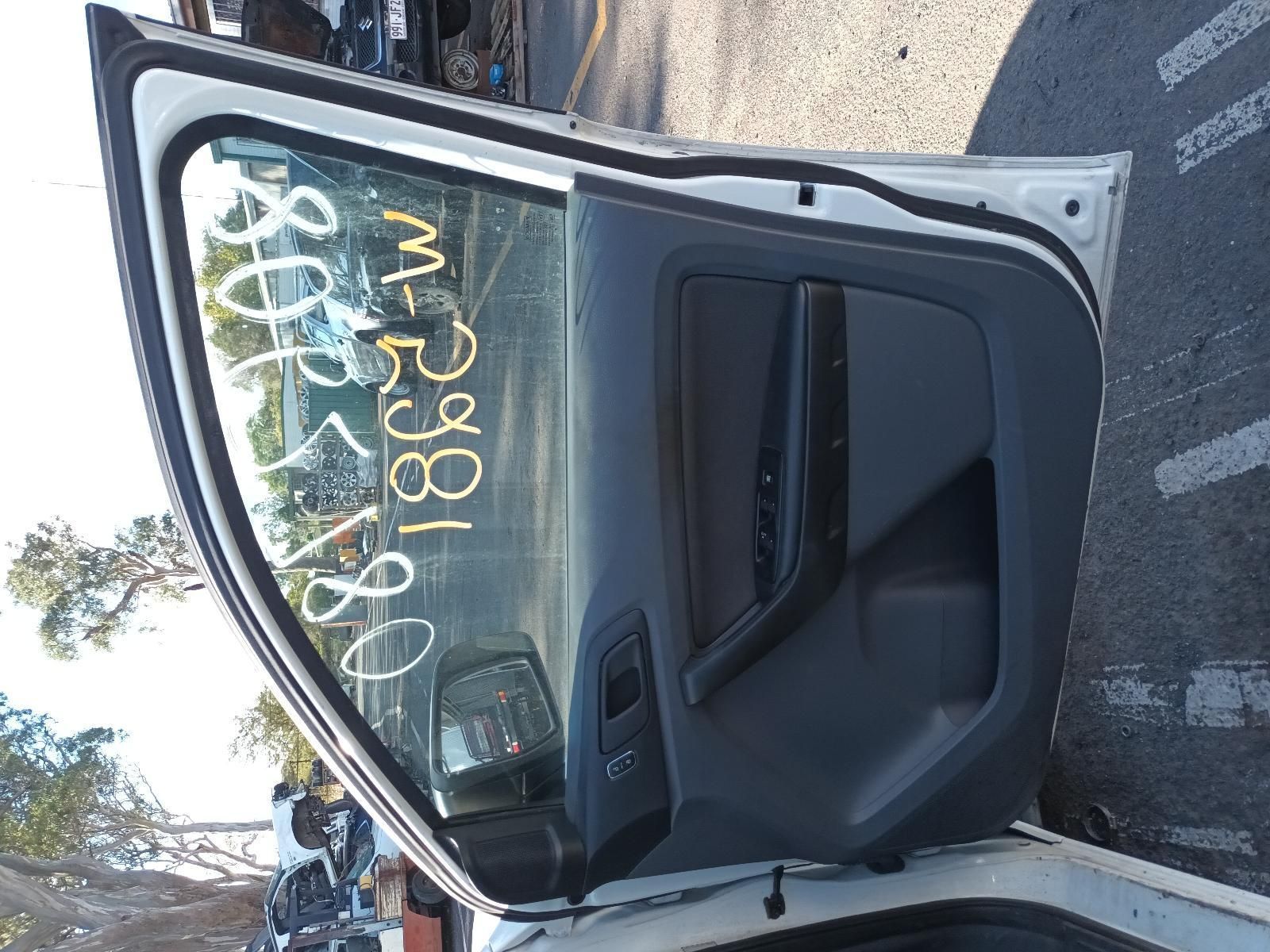 A White Car with the Door Open Has a Written Numbers on the Window — South West 4WD Wreckers in Harristown, QLD