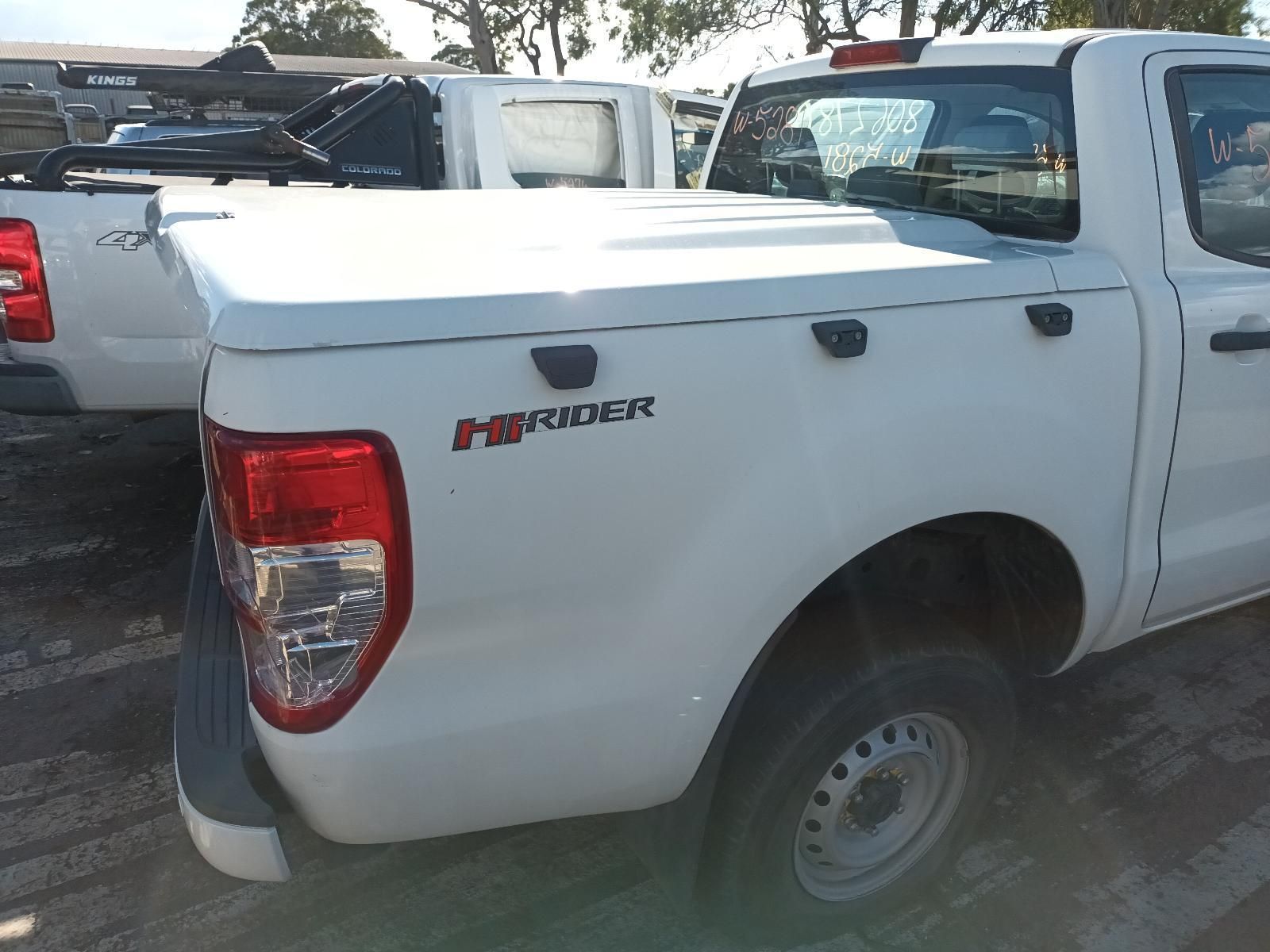 A White Ford Ranger Truck is Parked in a Parking Lot — South West 4WD Wreckers in Harristown, QLD