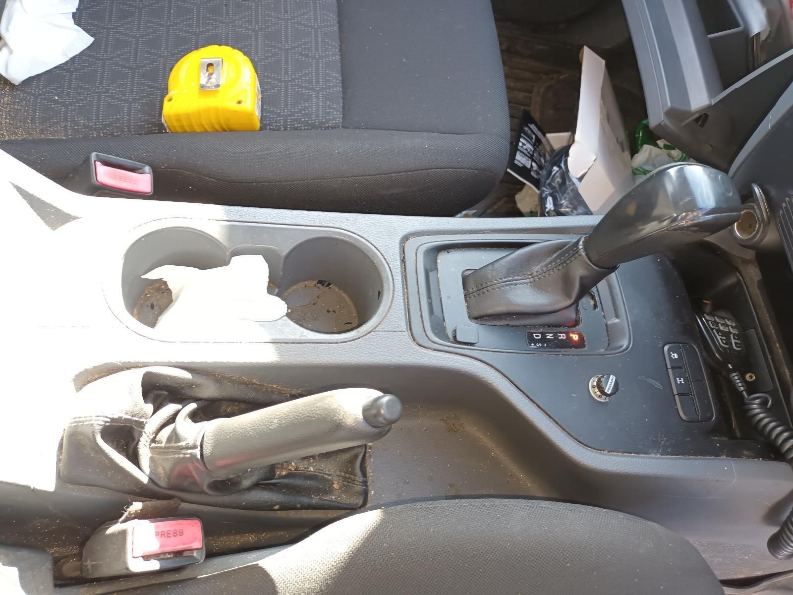 The Inside of a Car with a Cup Holder and a Tape Measure — South West 4WD Wreckers in Harristown, QLD
