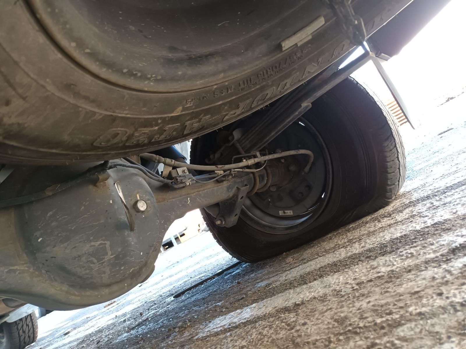 A Close Up of the Underside of a Car with a Flat Tire — South West 4WD Wreckers in Harristown, QLD