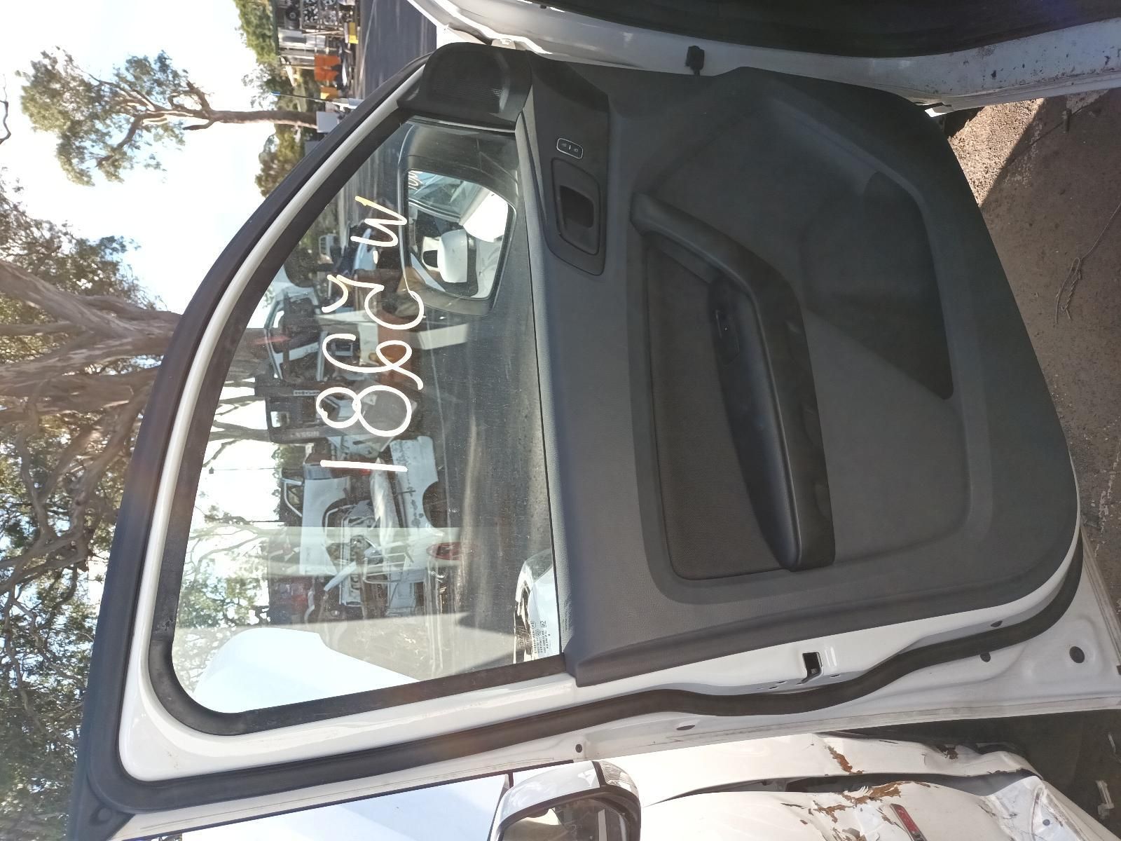 A White Car is Parked on the Side of the Road with the Door Open — South West 4WD Wreckers in Harristown, QLD