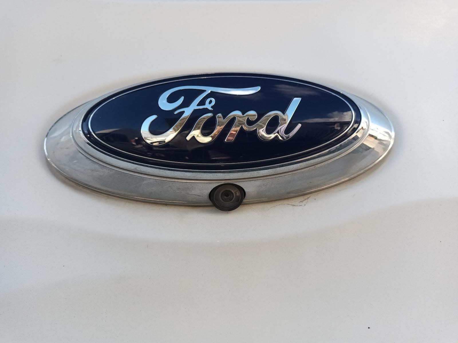 A Close Up of a Ford Emblem on a White Car — South West 4WD Wreckers in Harristown, QLD