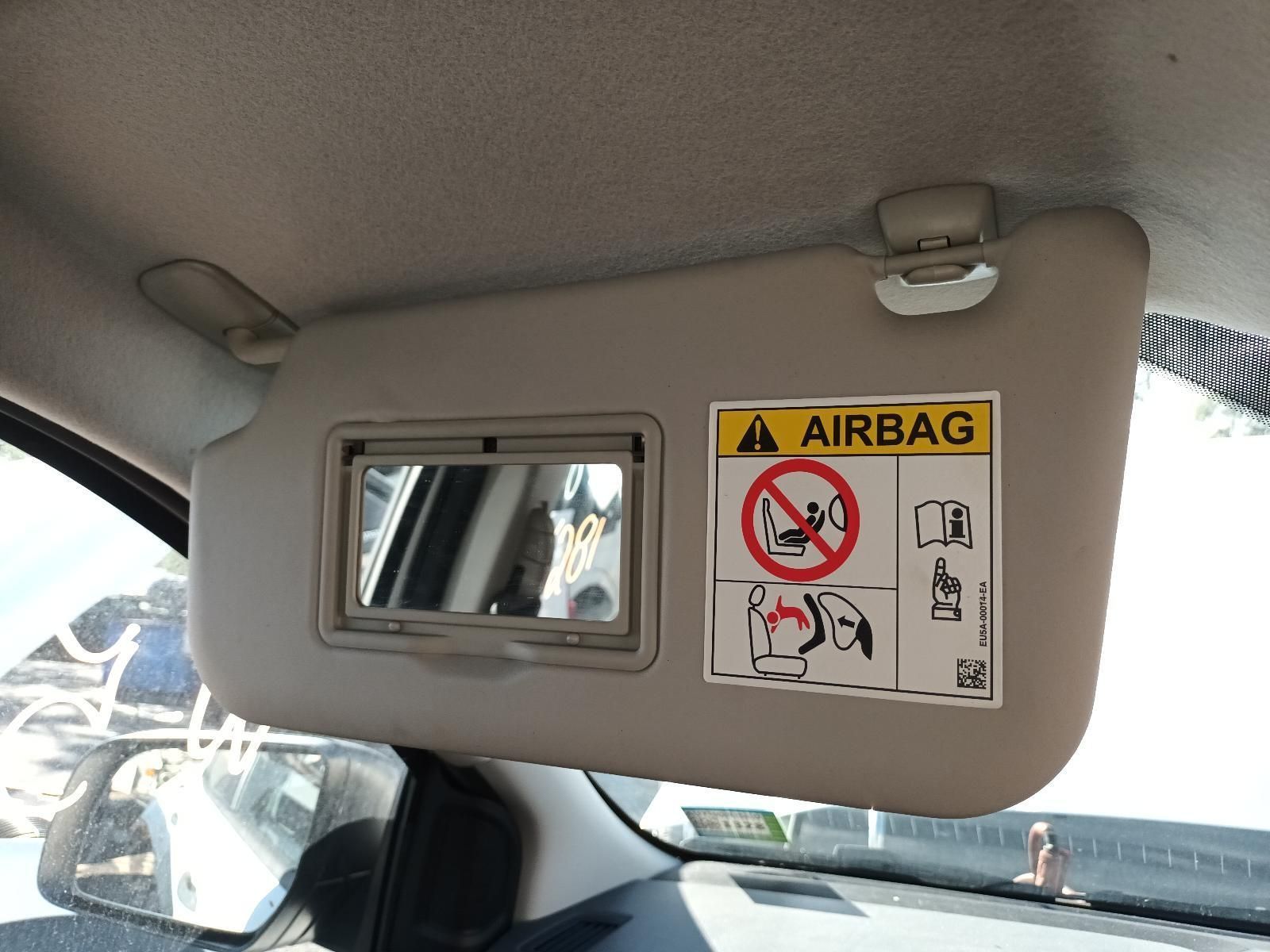 A Car Sun Visor with an Airbag Sticker on It — South West 4WD Wreckers in Harristown, QLD