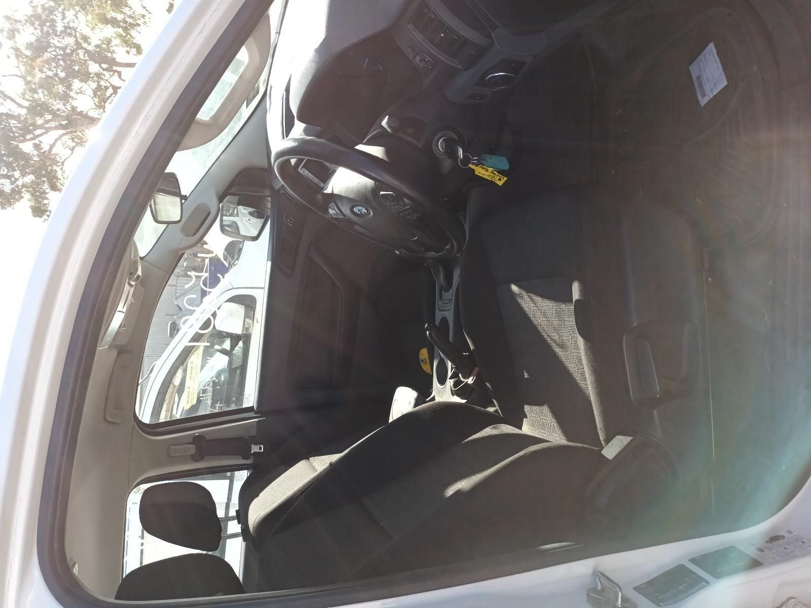 A White Car with a Black Seat and Steering Wheel — South West 4WD Wreckers in Harristown, QLD