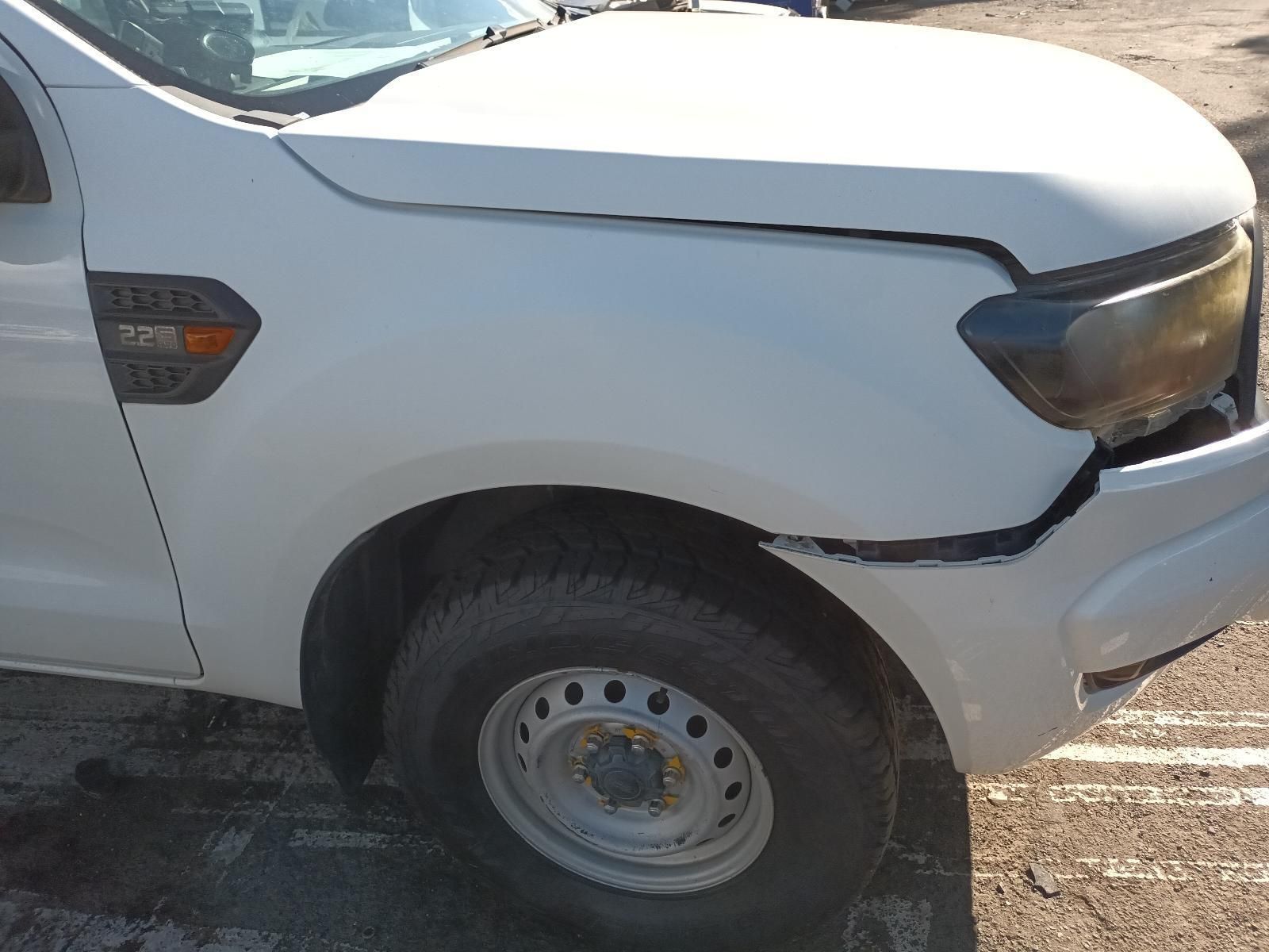 A White Truck with a Damaged Front Bumper is Parked in a Parking Lot — South West 4WD Wreckers in Harristown, QLD
