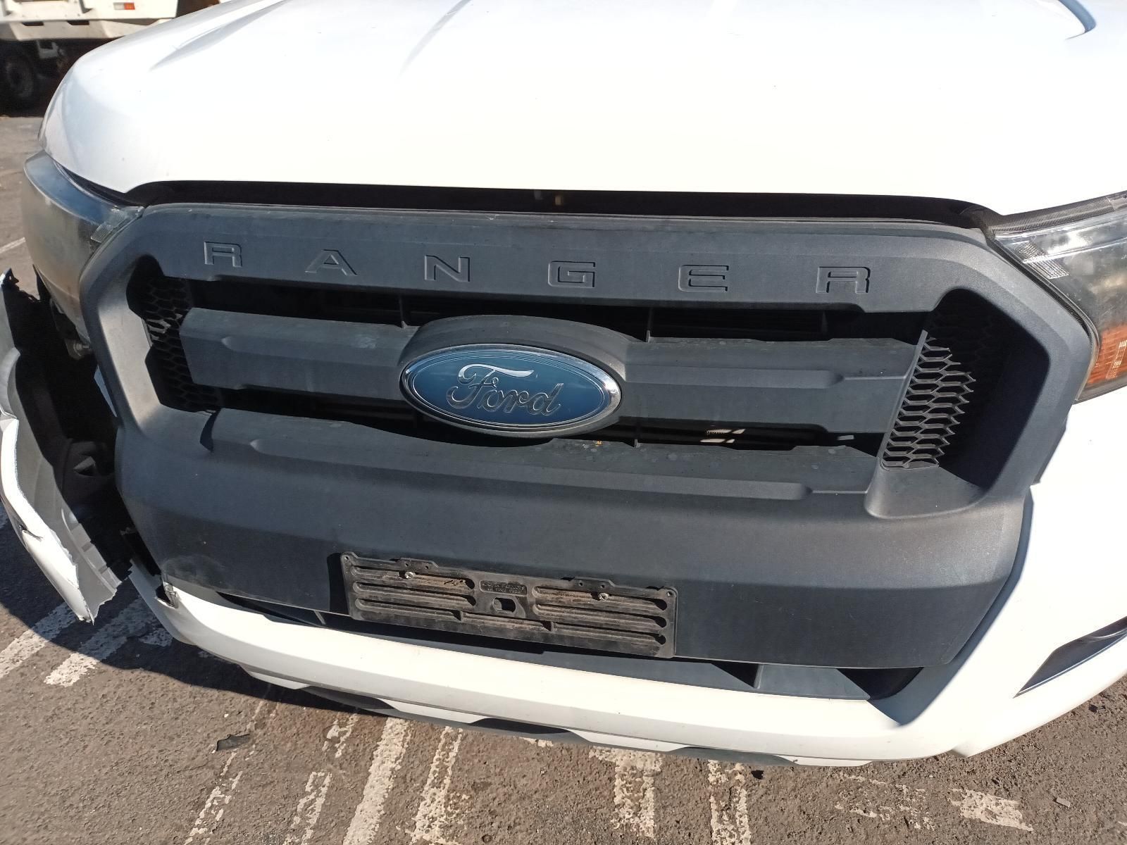 A White Ford Ranger is Parked in a Parking Lot — South West 4WD Wreckers in Harristown, QLD