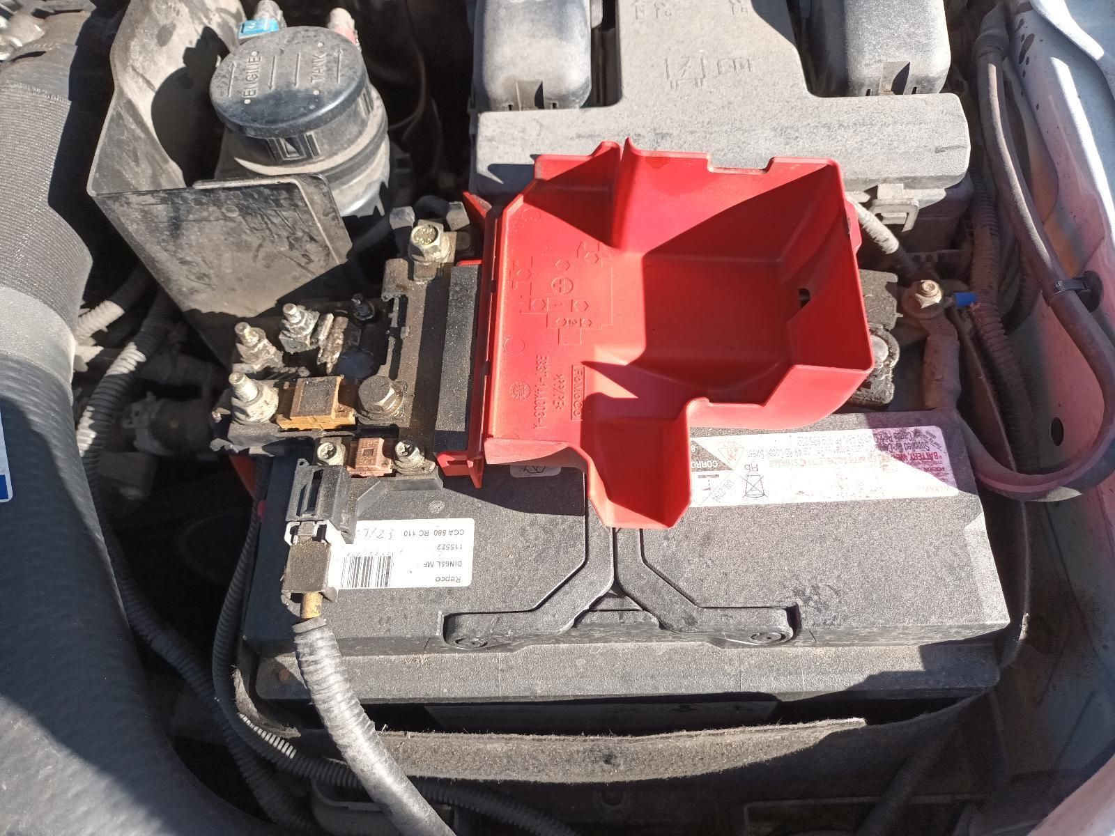 A Car Battery with a Red Tray on Top of It — South West 4WD Wreckers in Harristown, QLD