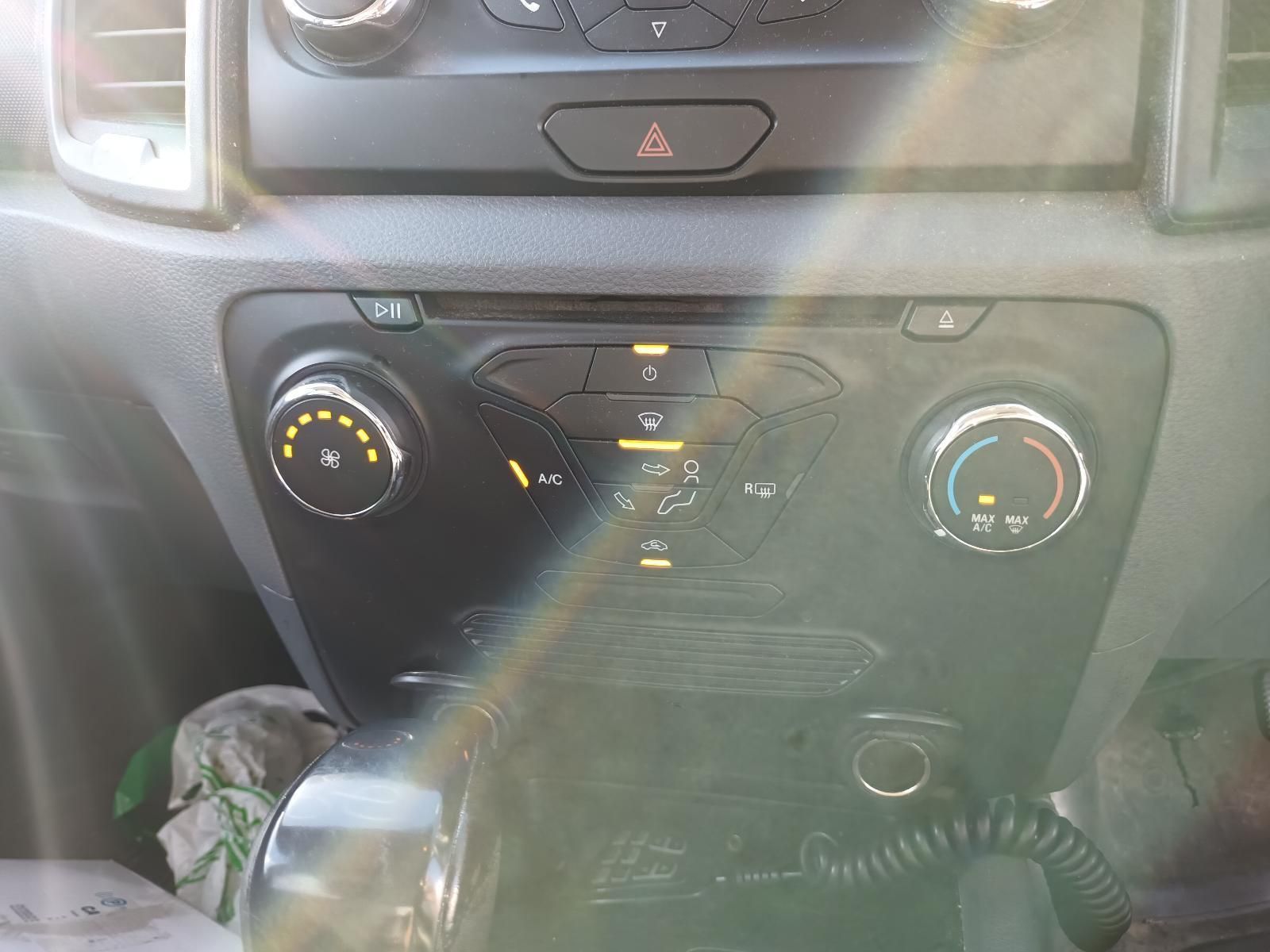 A Close Up of a Car Dashboard with a Radio and Air Conditioning Controls — South West 4WD Wreckers in Harristown, QLD