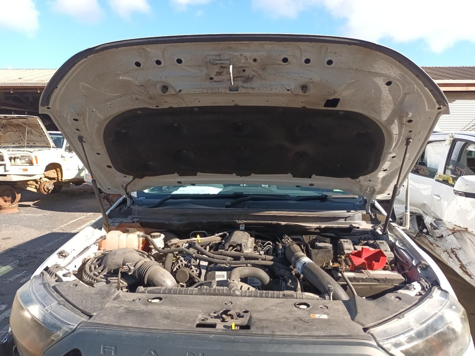 The Hood of a White Truck is Open and the Engine is Visible — South West 4WD Wreckers in Harristown, QLD