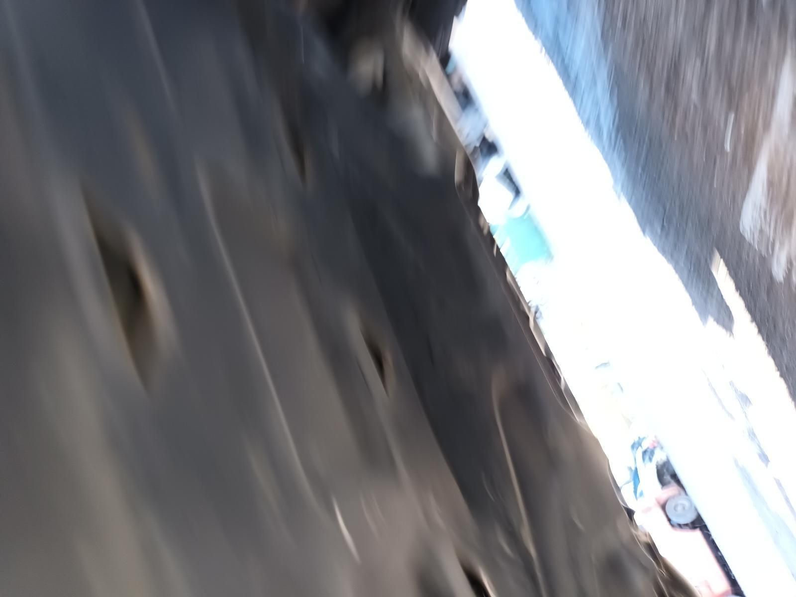 A Blurred Image of a Person Walking Down a Street — South West 4WD Wreckers in Harristown, QLD