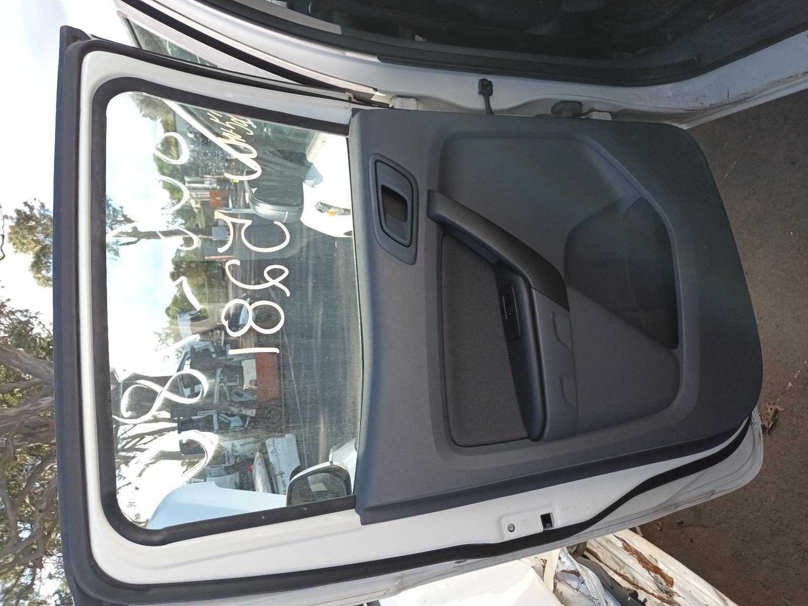 A White Car with the Door Open Has a Written on the Window — South West 4WD Wreckers in Harristown, QLD