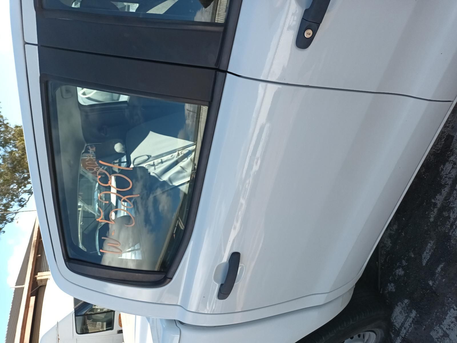 A White Car is Parked on the Side of the Road — South West 4WD Wreckers in Harristown, QLD