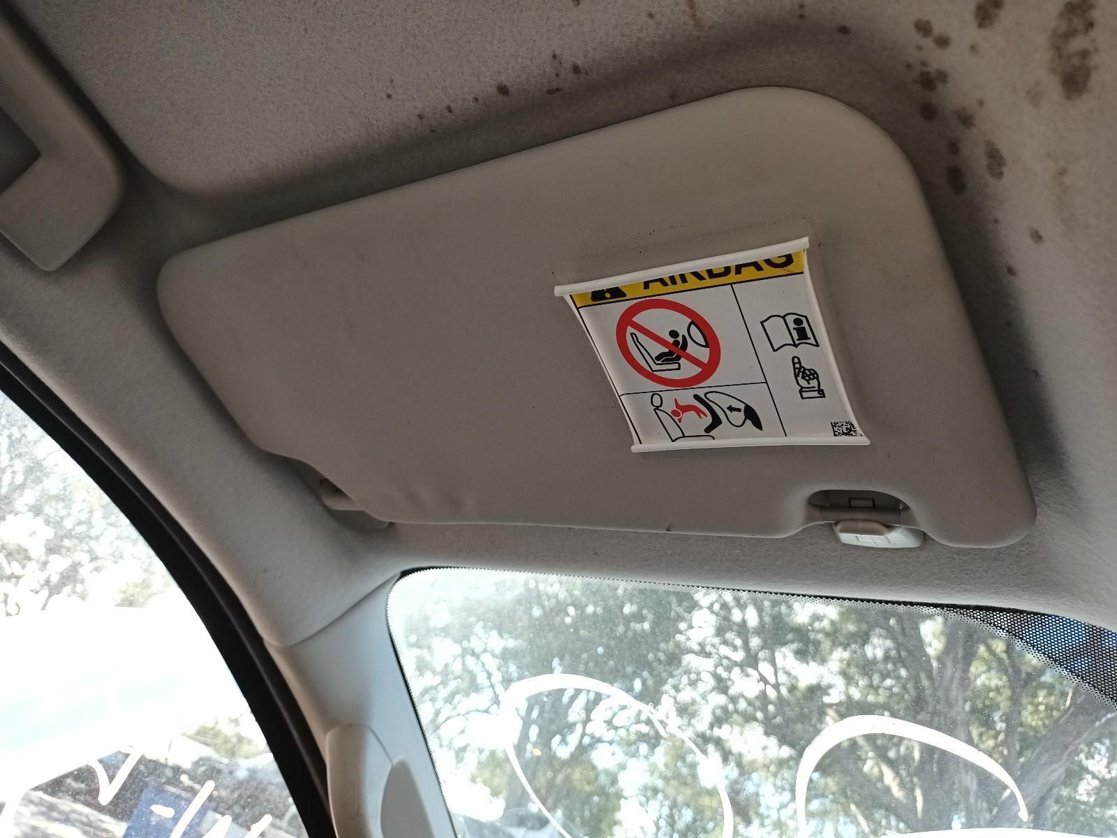 A Sun Visor in a Car with a Warning Sticker on It — South West 4WD Wreckers in Harristown, QLD