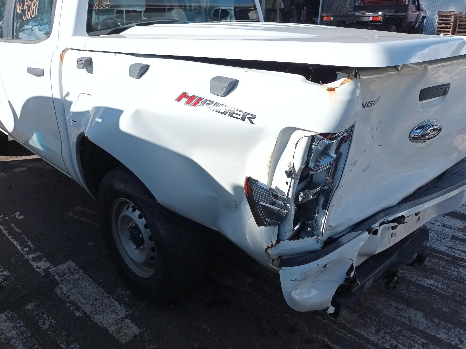 A White Truck with a Damaged on the Back — South West 4WD Wreckers in Harristown, QLD