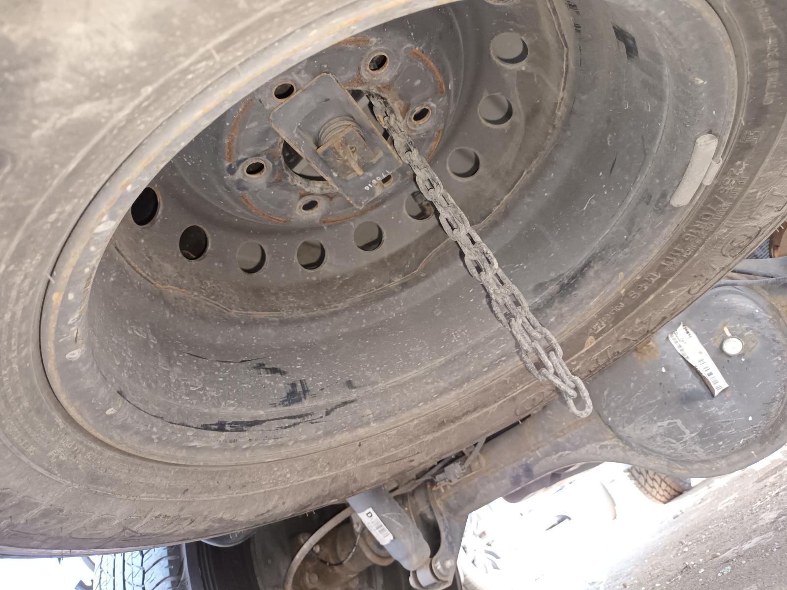 A Close Up of a Tire with a Chain Attached to It — South West 4WD Wreckers in Harristown, QLD