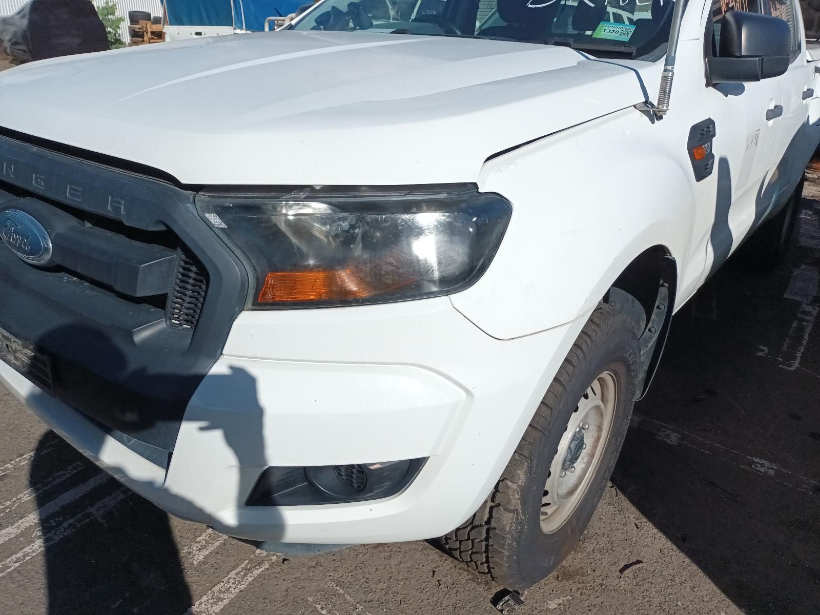 A White Ford Ranger Truck is Parked in a Parking Lot — South West 4WD Wreckers in Harristown, QLD