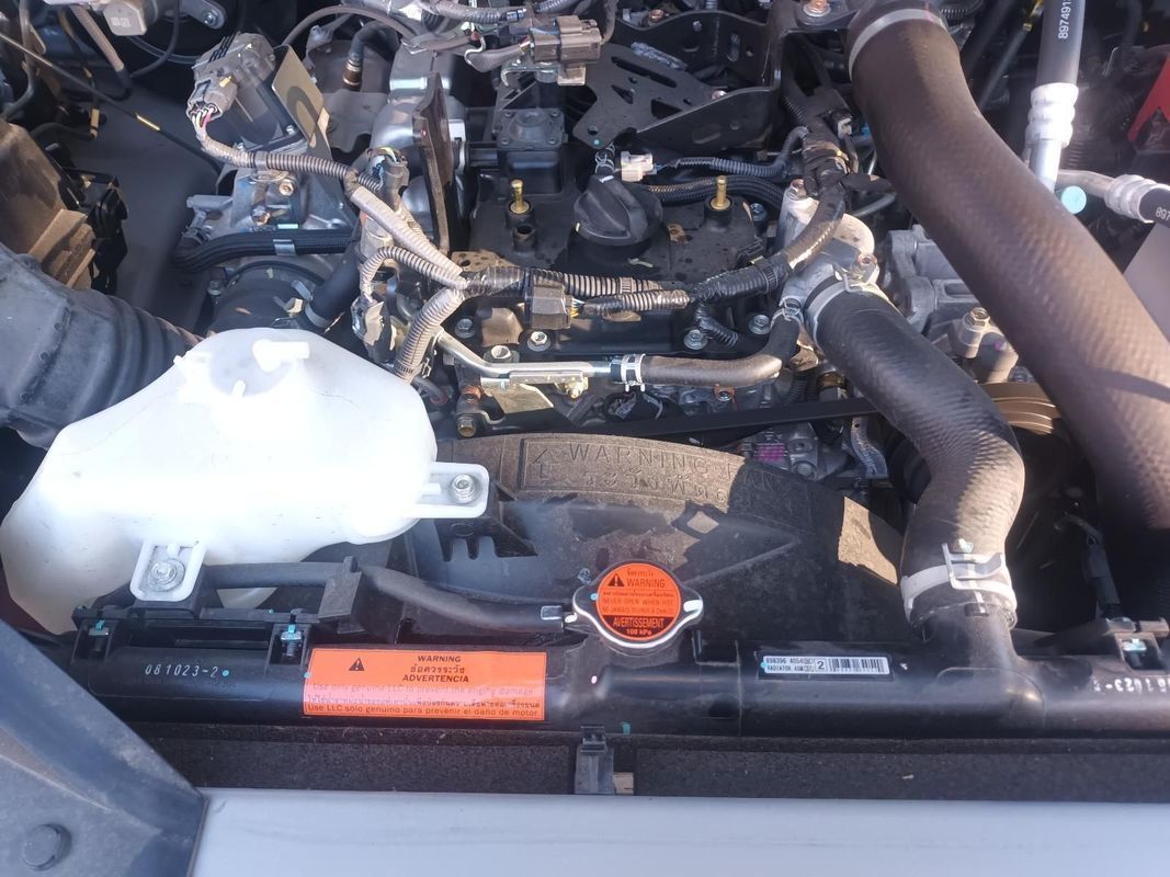 A Person is Working on the Engine of a Car — South West 4WD Wreckers in Harristown, QLD