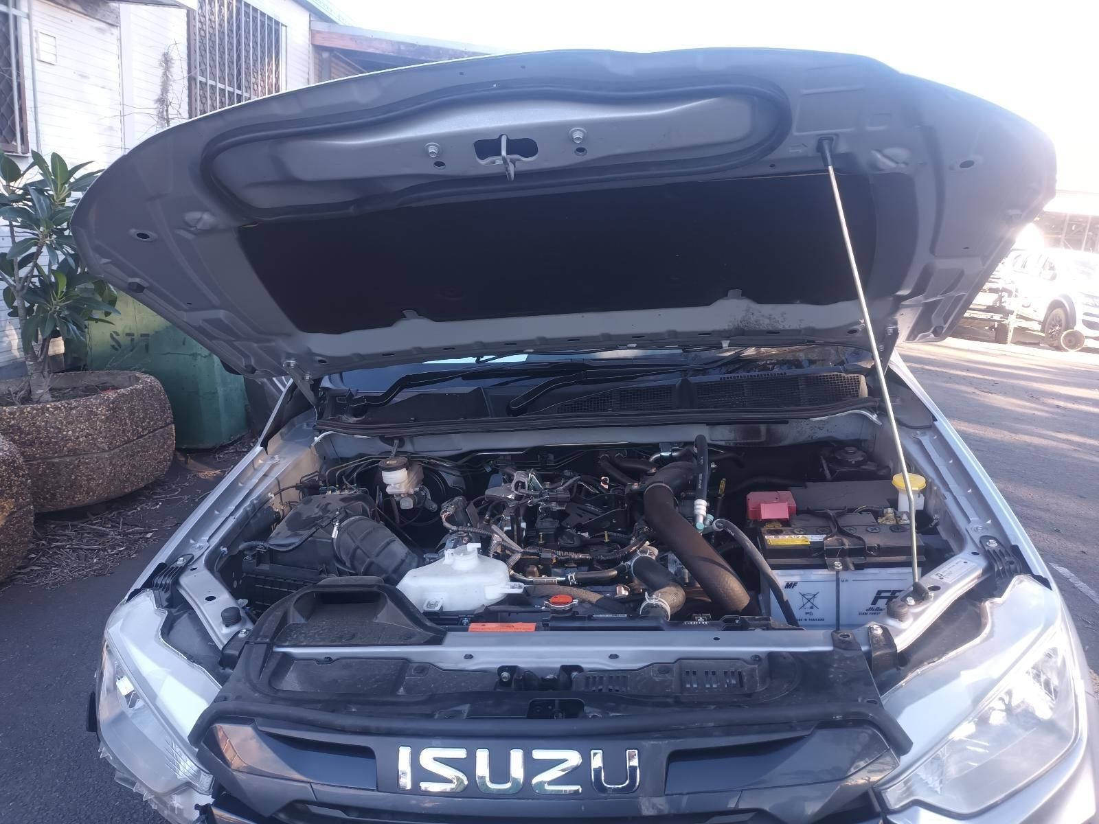 The Hood of a Silver Isuzu Truck is Open — South West 4WD Wreckers in Harristown, QLD