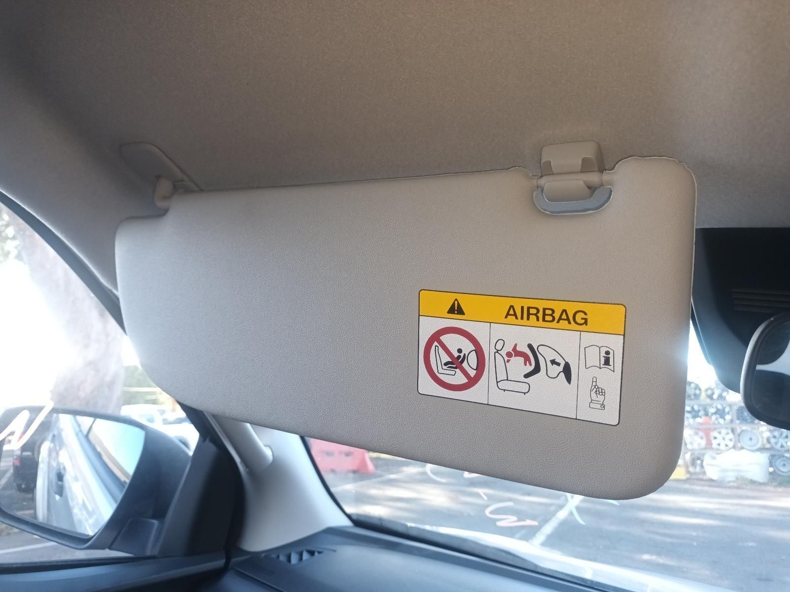 A Sun Visor with a Warning Label on It That Says Airbag — South West 4WD Wreckers in Harristown, QLD