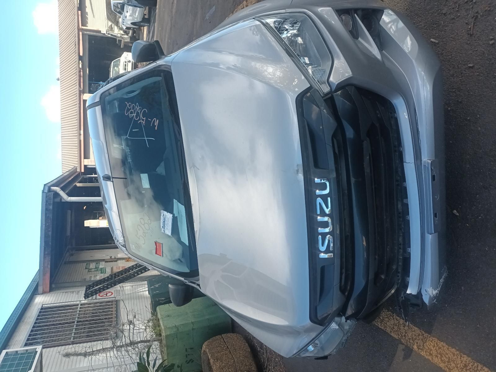 A Silver Isuzu Truck is Parked in a Parking Lot — South West 4WD Wreckers in Harristown, QLD