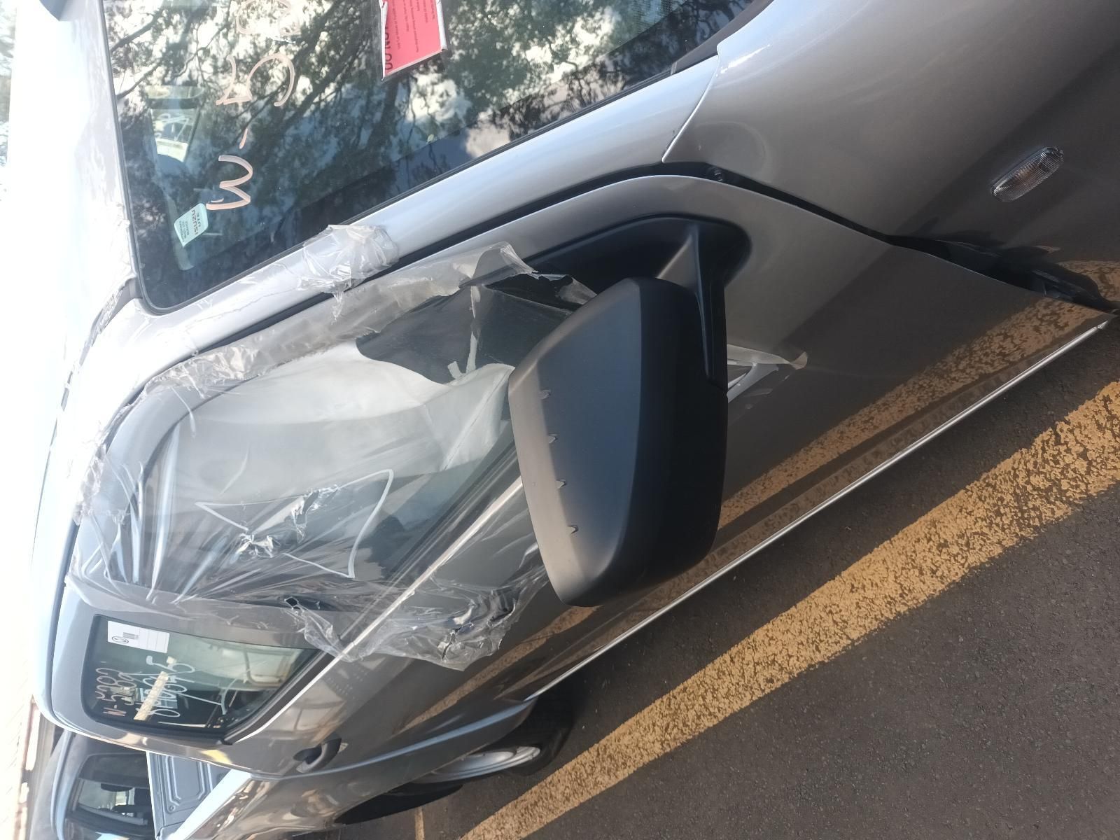A Silver Car is Parked on the Side of the Road — South West 4WD Wreckers in Harristown, QLD