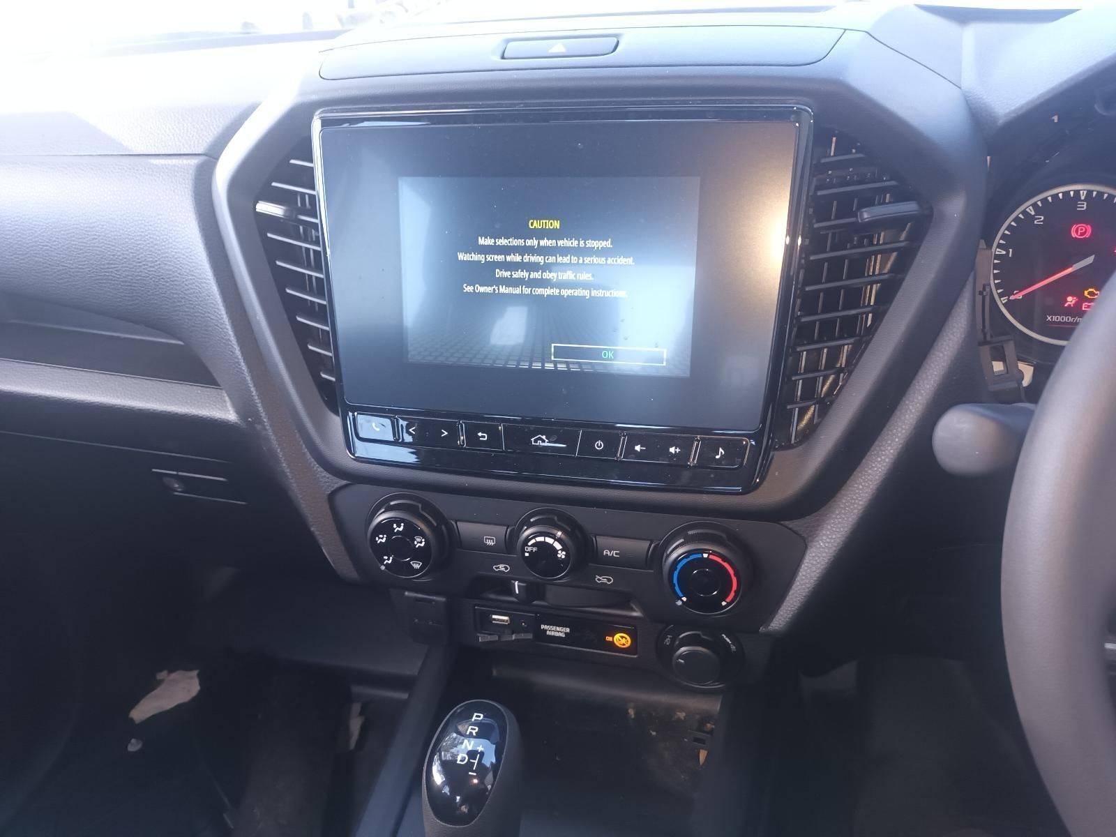 The Dashboard of a Car with a Warning Message on the Screen — South West 4WD Wreckers in Harristown, QLD