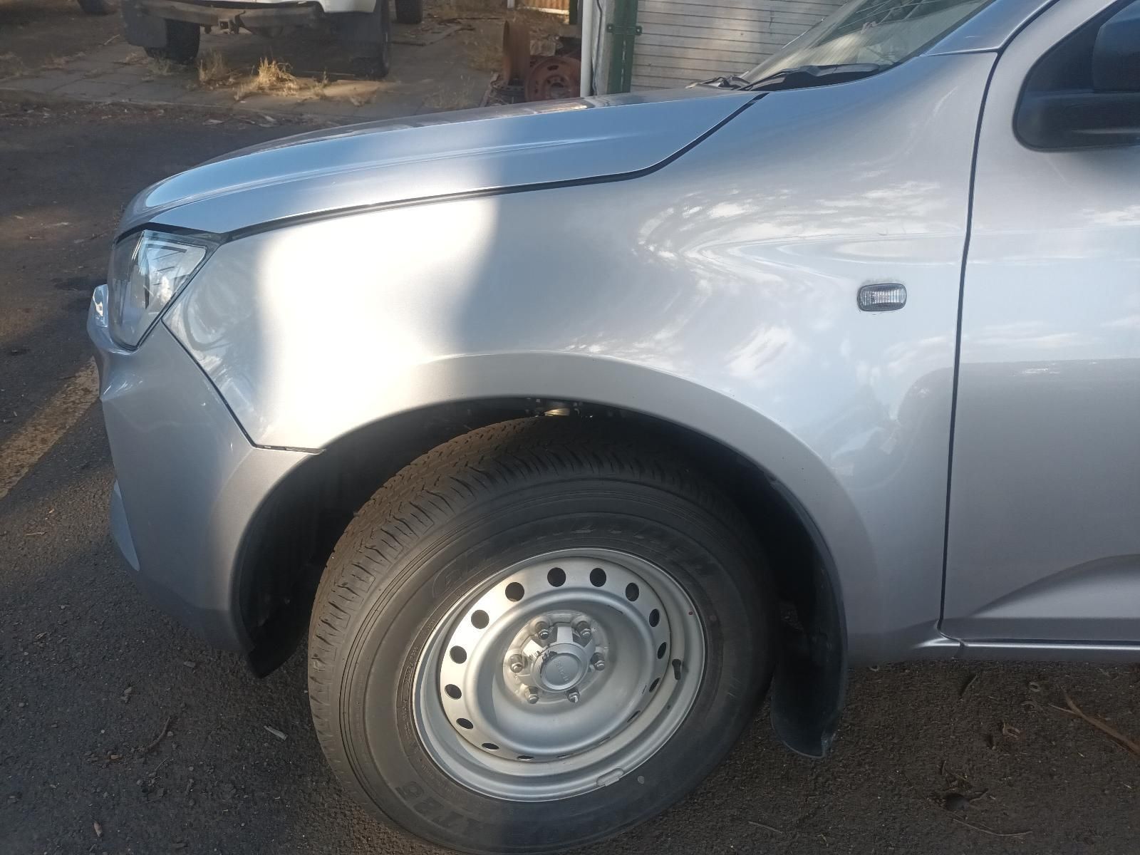 A Silver Truck is Parked on the Side of the Road — South West 4WD Wreckers in Harristown, QLD