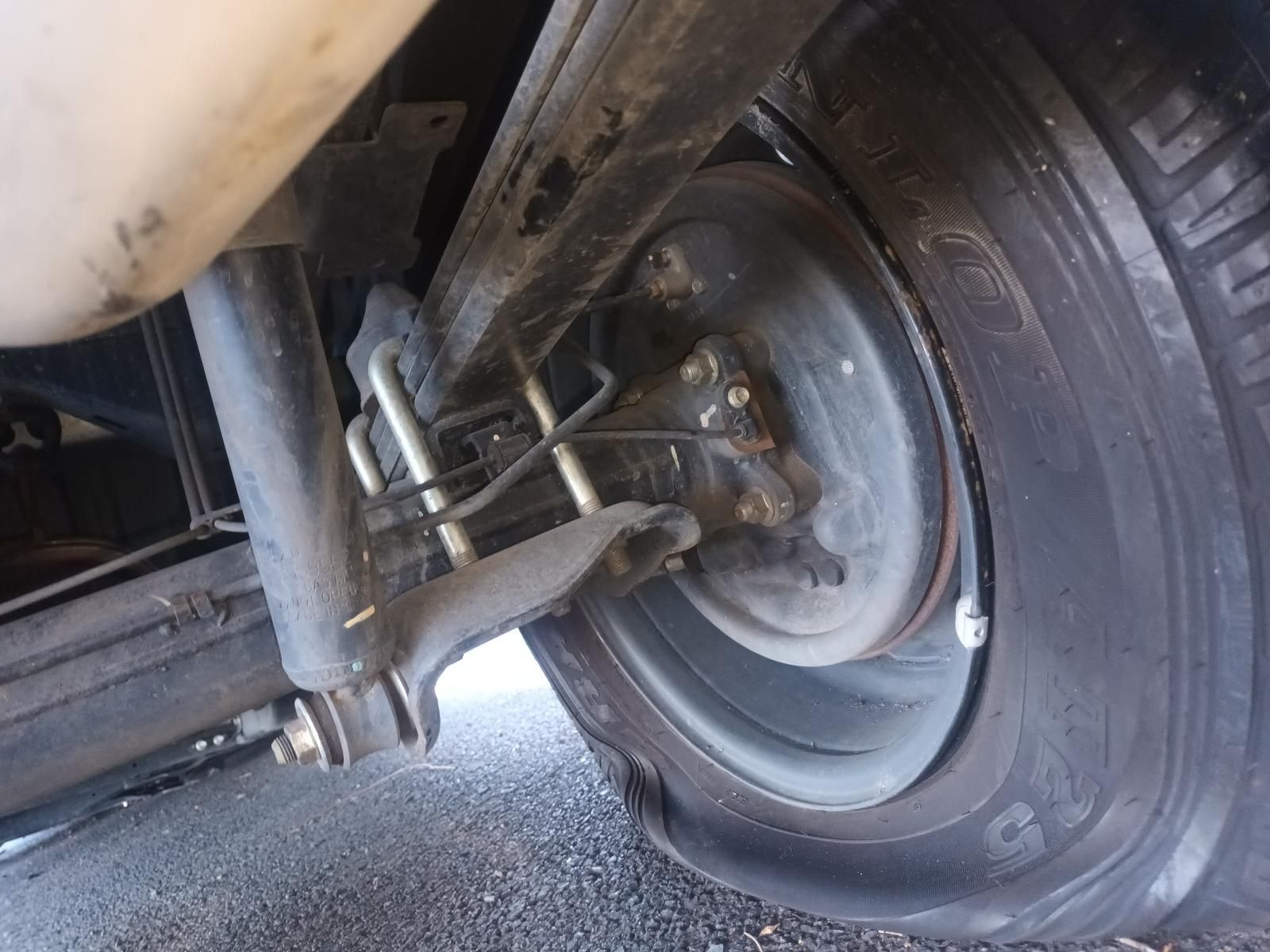 A Close Up of a Car Wheel with a Flat Tire — South West 4WD Wreckers in Harristown, QLD