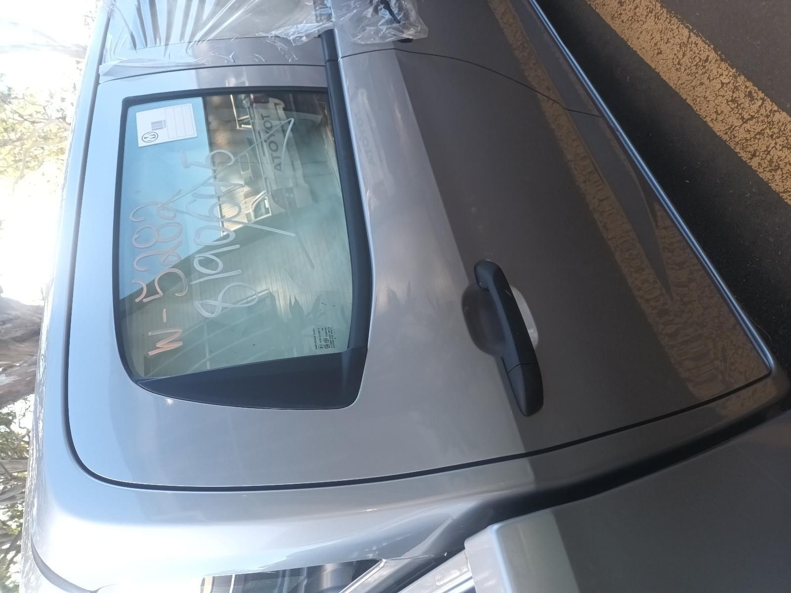 A Silver Car is Parked on the Side of the Road — South West 4WD Wreckers in Harristown, QLD