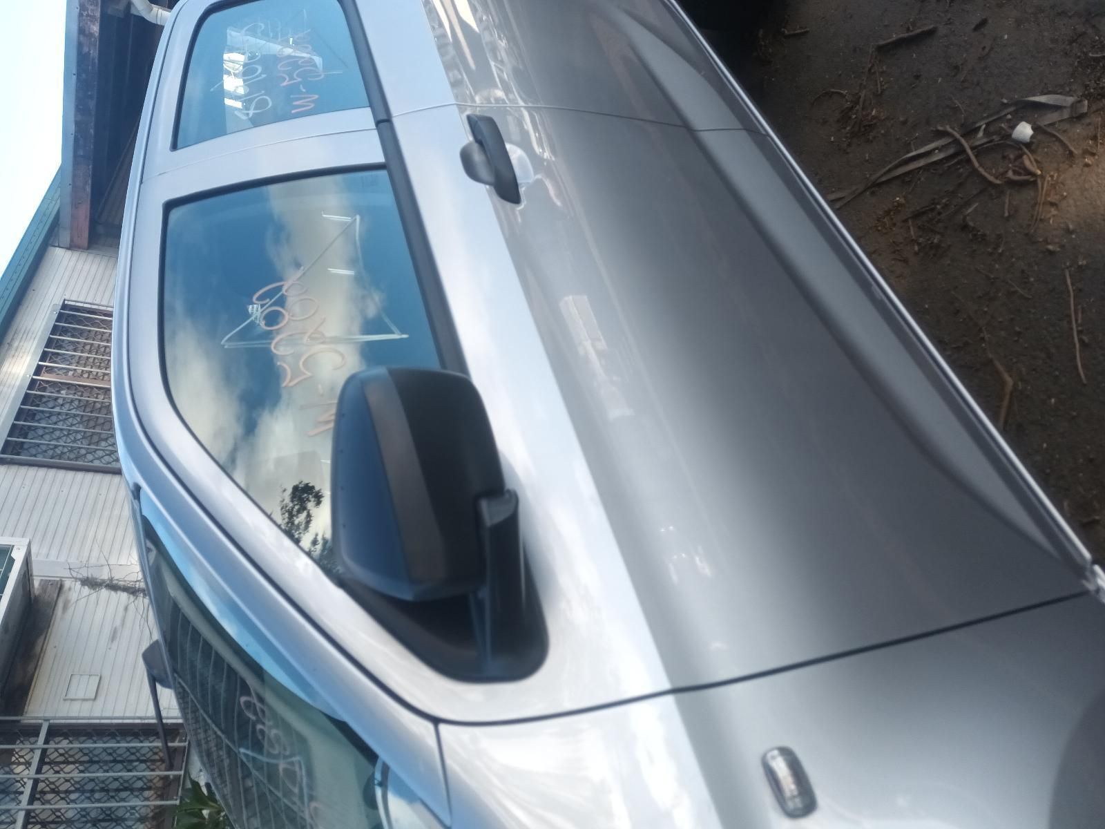 A Silver Car is Parked in Front of a Building — South West 4WD Wreckers in Harristown, QLD