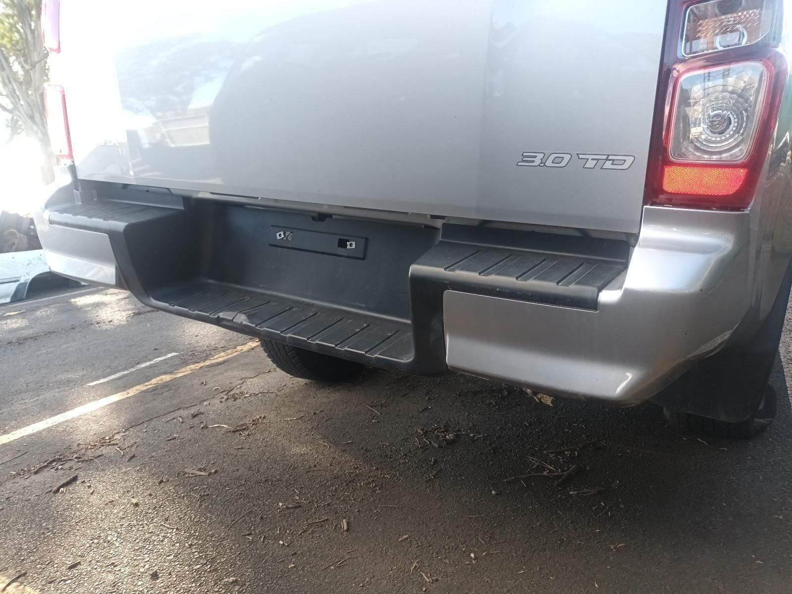 A Silver Pickup Truck is Parked on the Side of the Road — South West 4WD Wreckers in Harristown, QLD