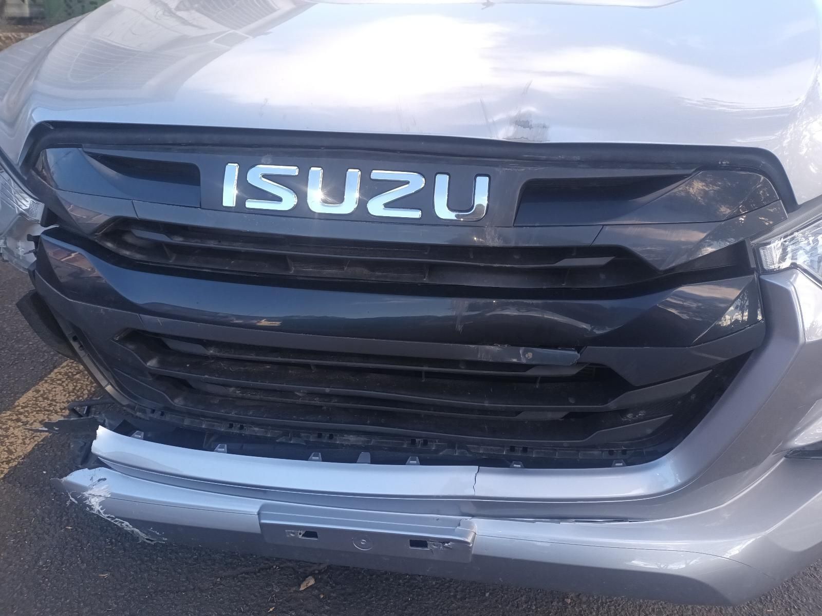 The Front of a Silver Isuzu Truck is Damaged — South West 4WD Wreckers in Harristown, QLD