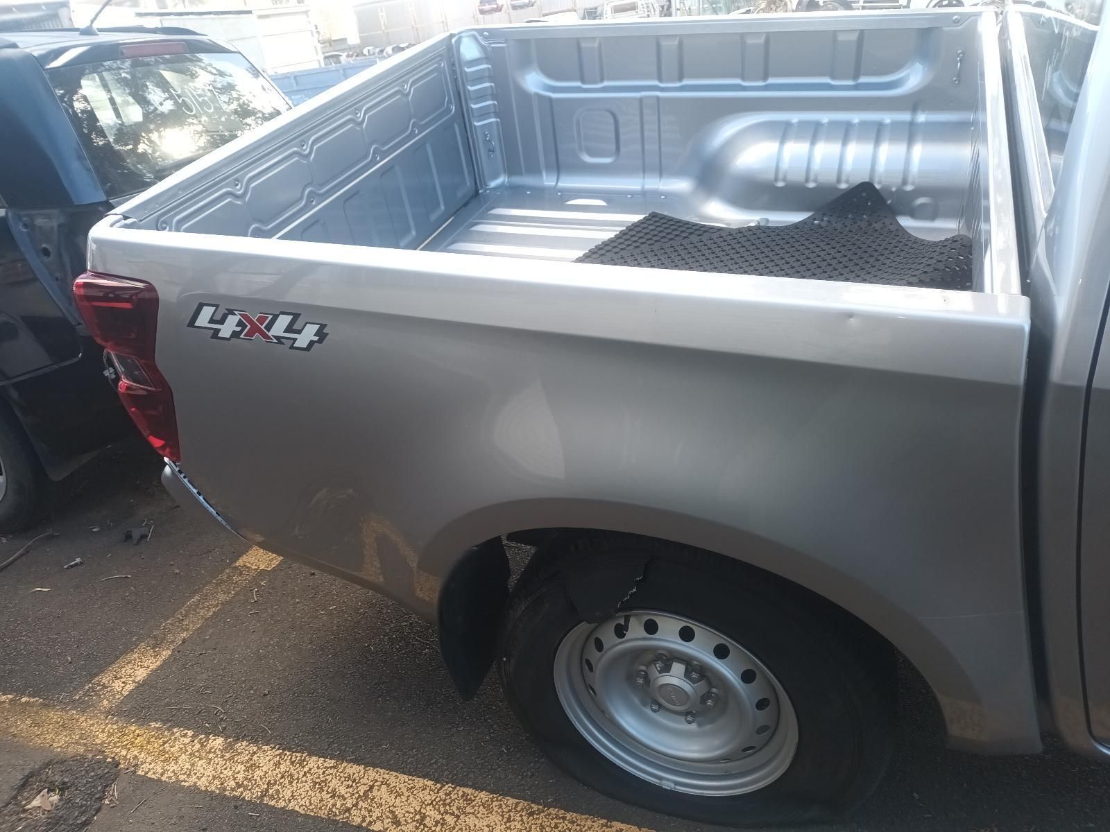 A Silver Pickup Truck is Parked in a Parking Lot — South West 4WD Wreckers in Harristown, QLD