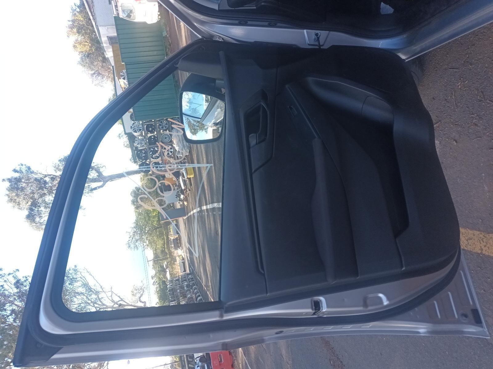 A Car with the Door Open is Parked on the Side of the Road — South West 4WD Wreckers in Harristown, QLD