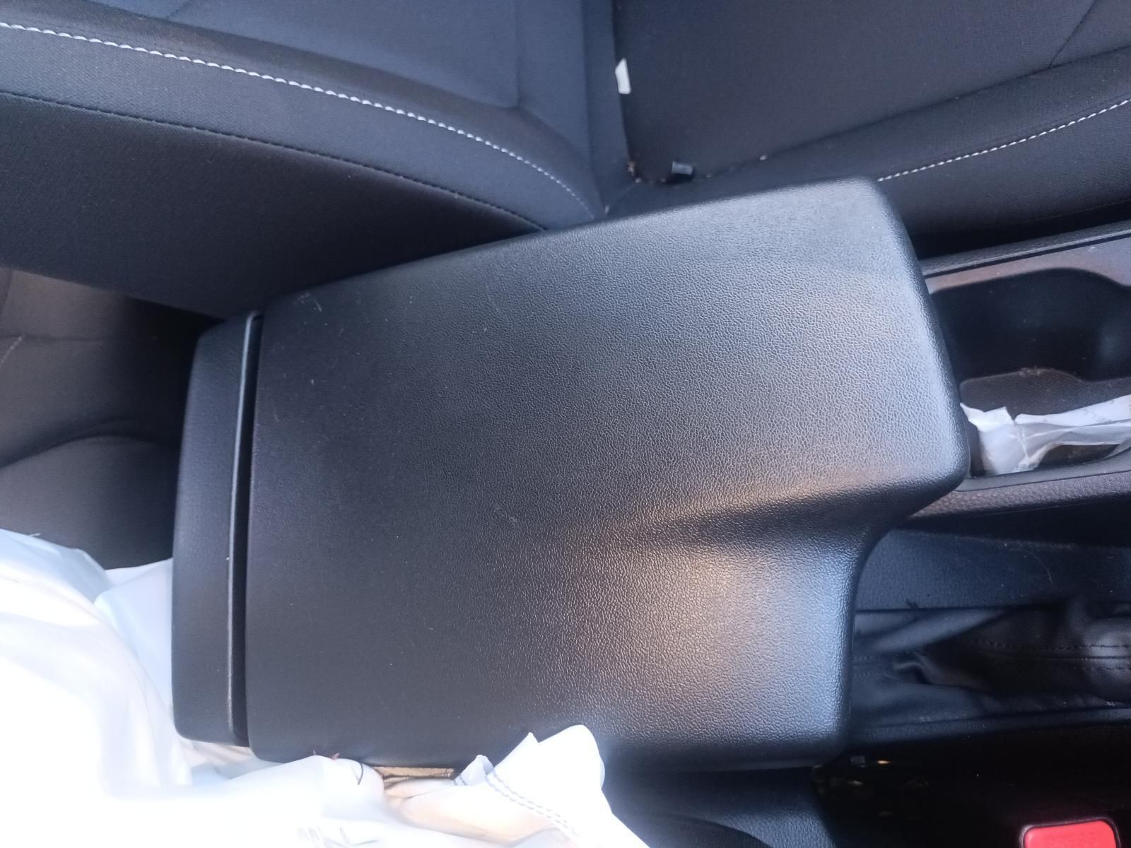 A Black Arm Rest in a Car with Tissues in It — South West 4WD Wreckers in Harristown, QLD