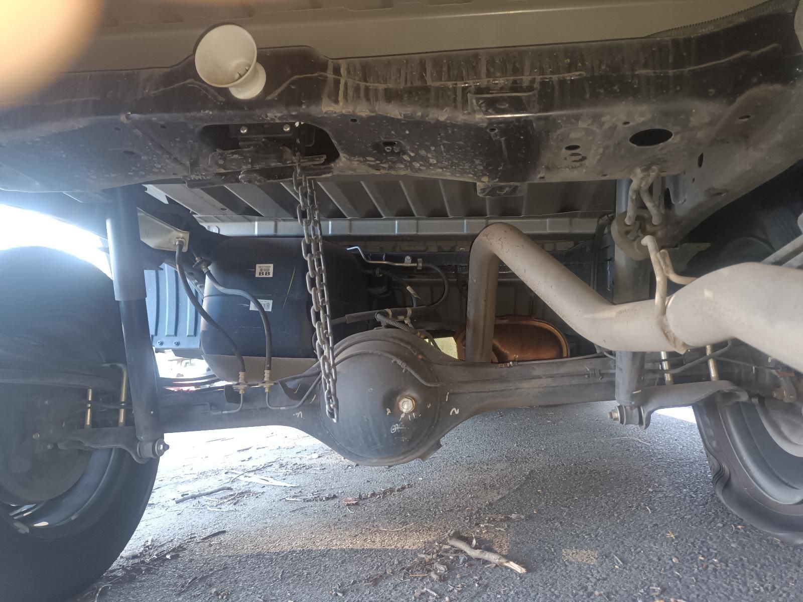 The Underside of a Truck with a Chain Attached to It — South West 4WD Wreckers in Harristown, QLD