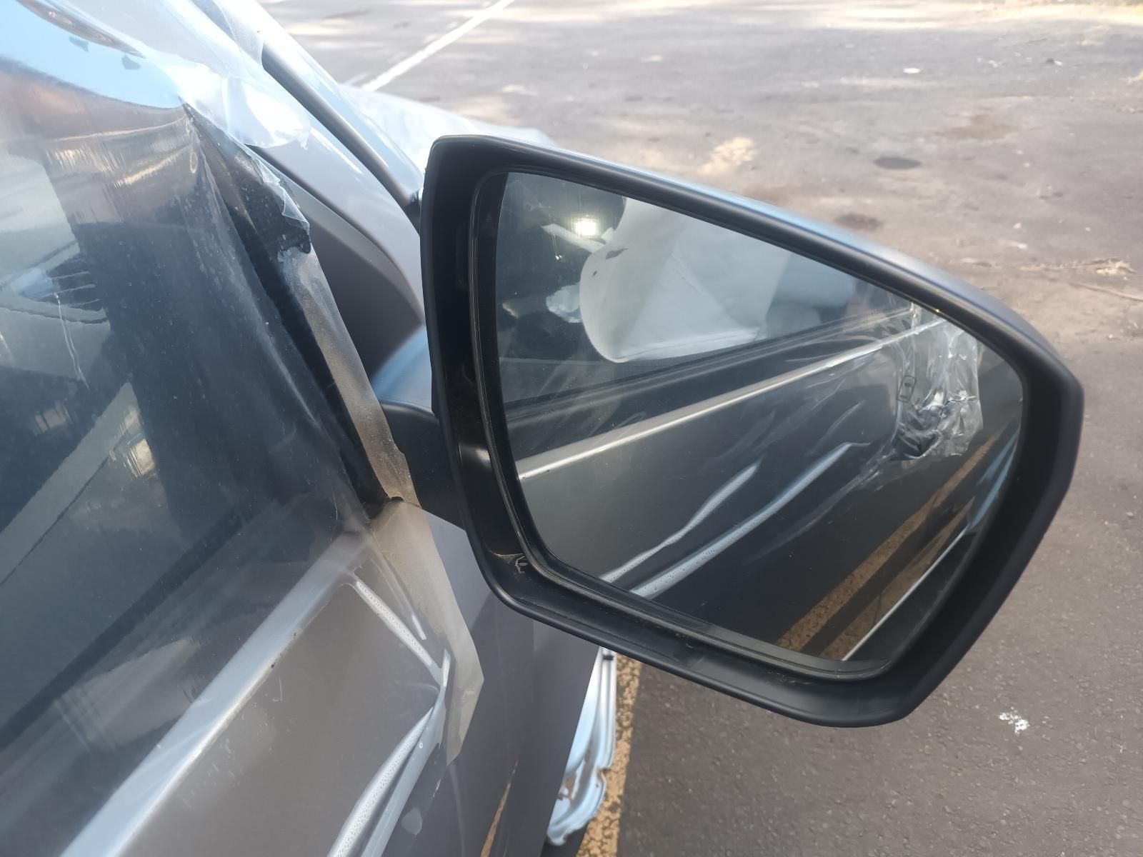 A Close Up of a Car 's Side Mirror in a Parking Lot — South West 4WD Wreckers in Harristown, QLD